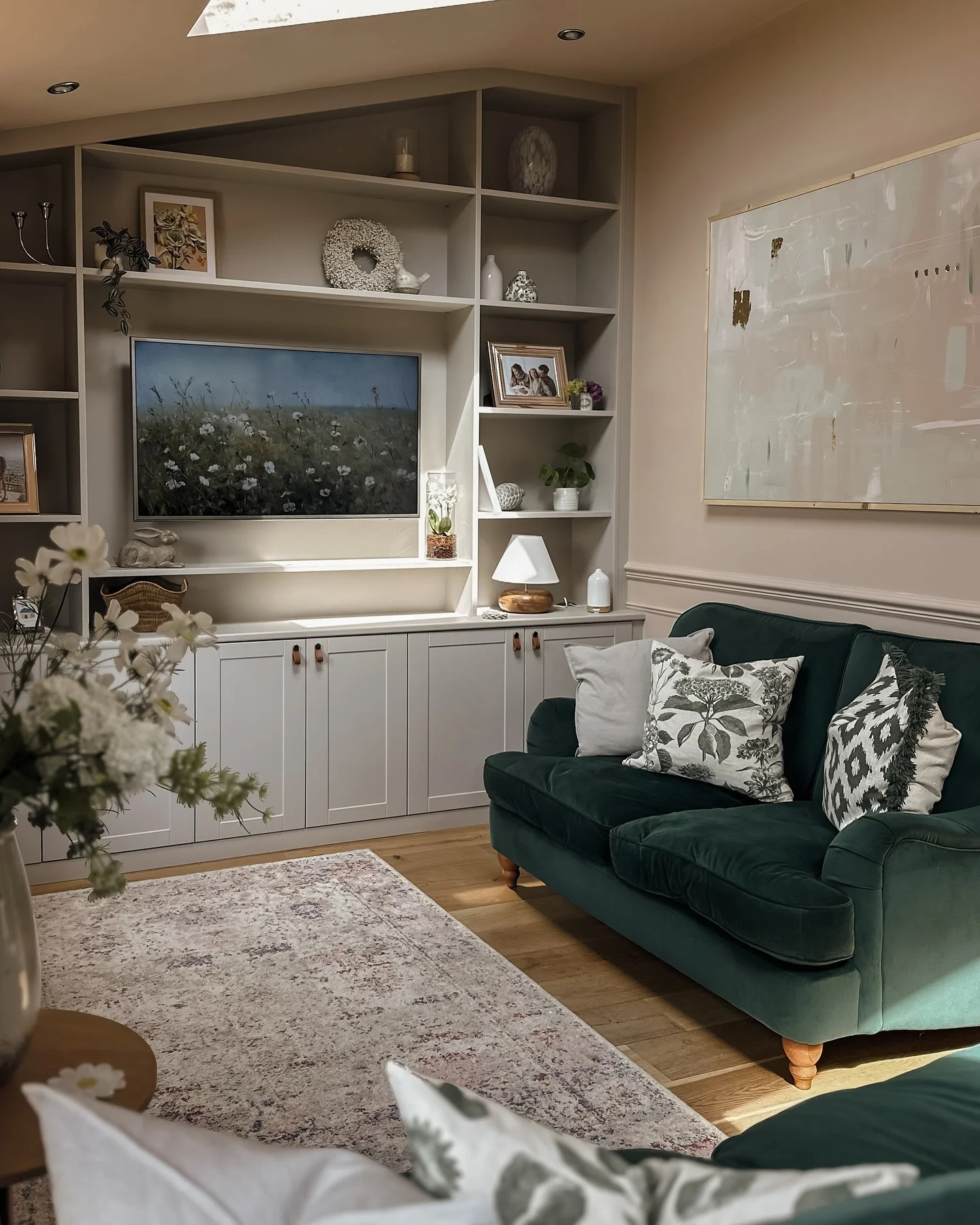 11. Layered Neutrals with Emerald Accents (Living Room Shelf Ideas)