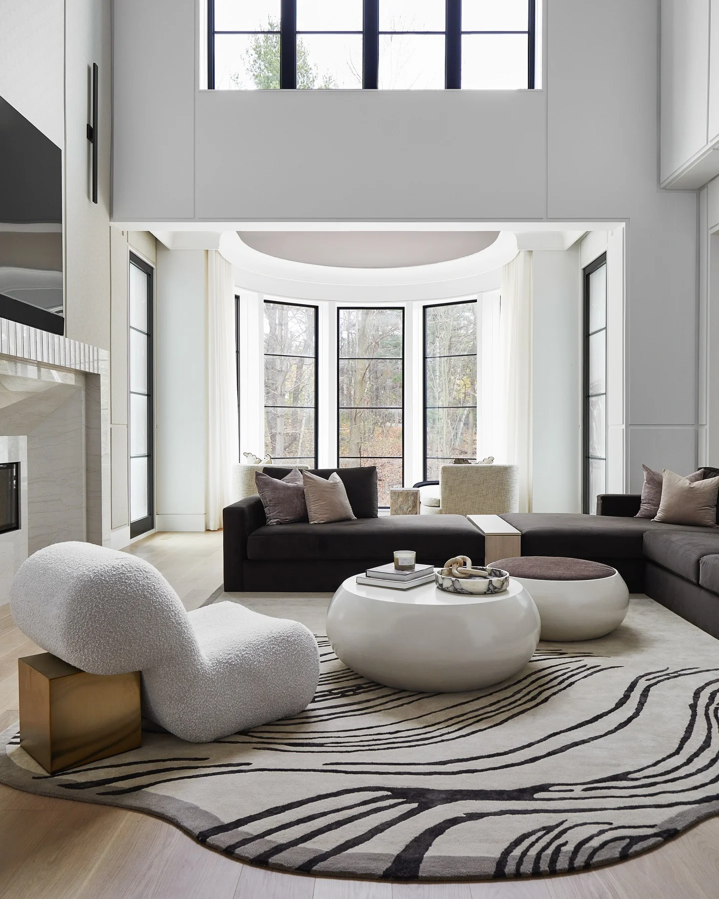 2. Sculptural Lines and Natural Light (Gray and White Living Room Ideas)