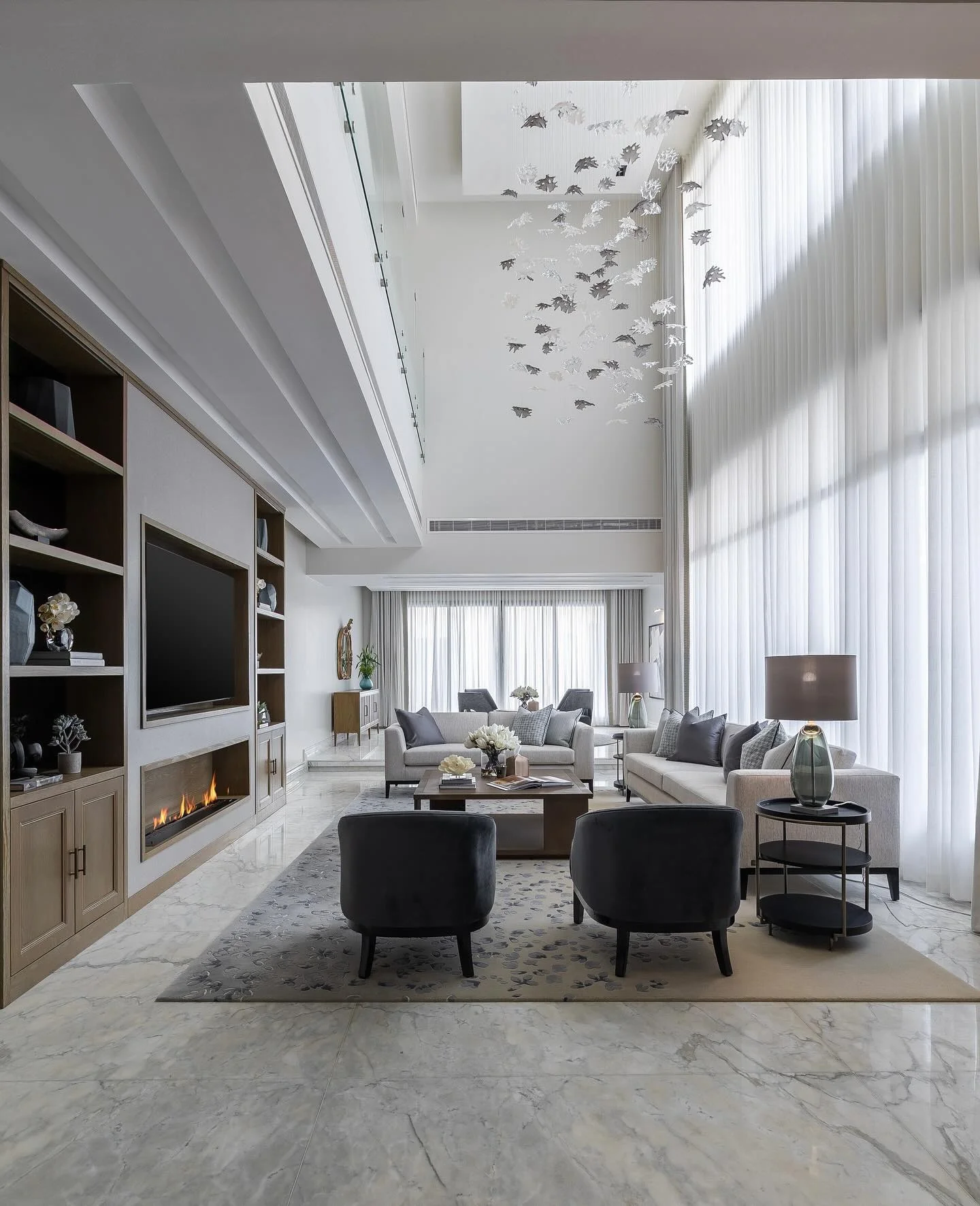 5. Grand Elegance with Monochrome Layers (Gray and White Living Room Ideas)