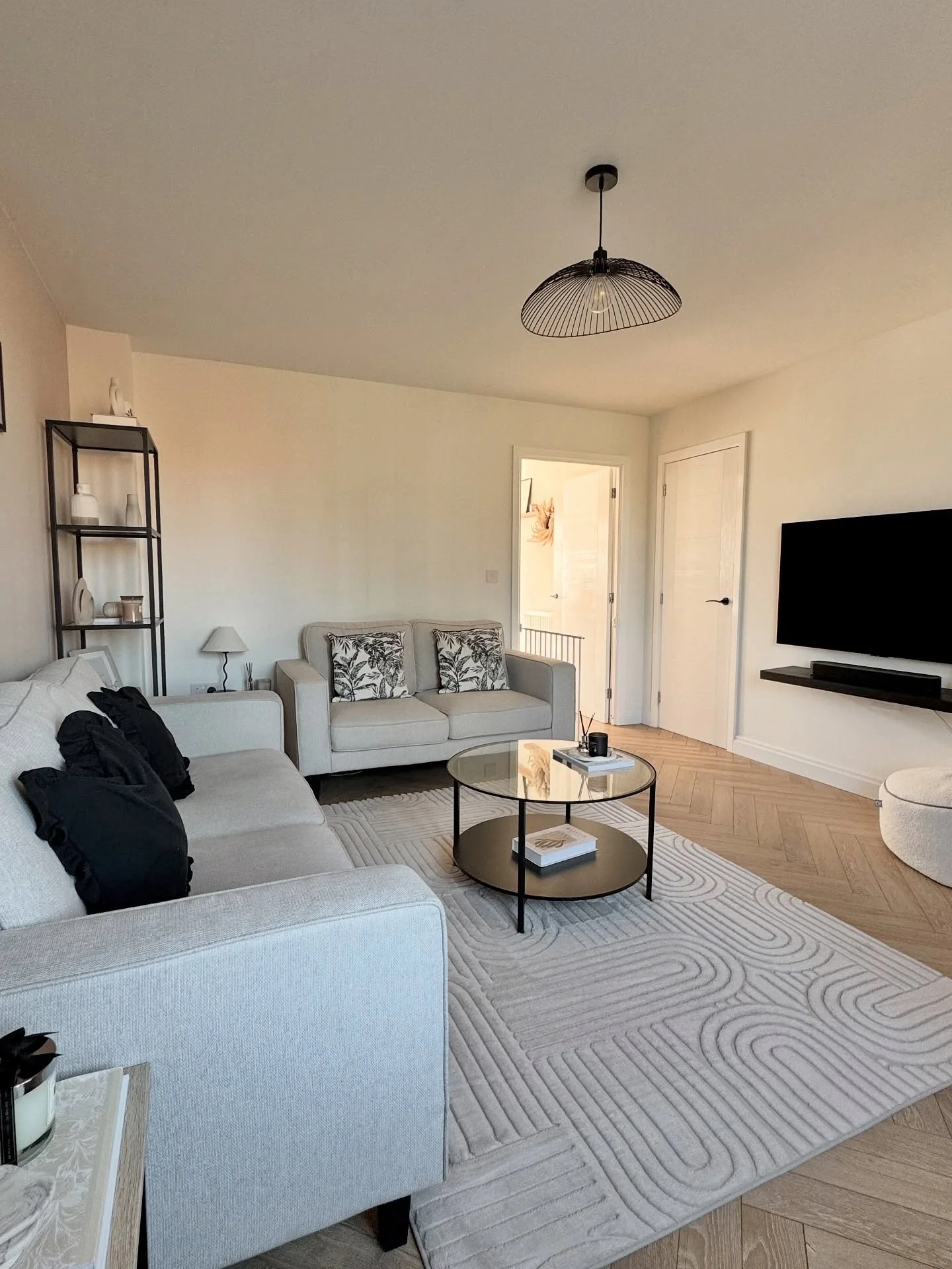 14. Clean Minimalism with Graphic Touches (Gray and White Living Room Ideas)