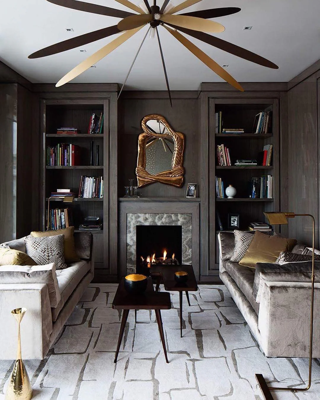 9. Moody Modern with Artistic Warmth (Grey and Gold Living Room Ideas)