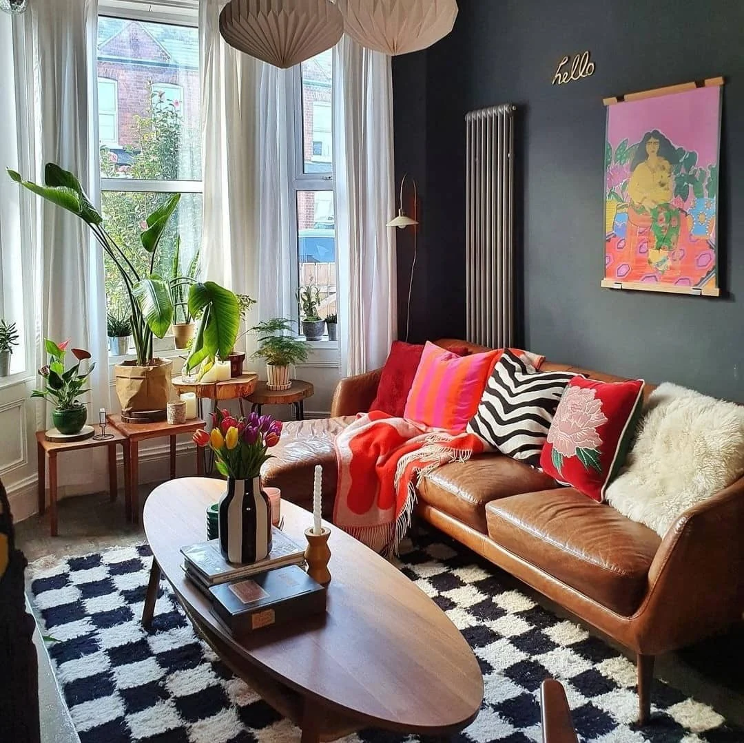 9. Graphic & Bold with Retro Flair (Brown Leather Sofa Living Room Ideas)