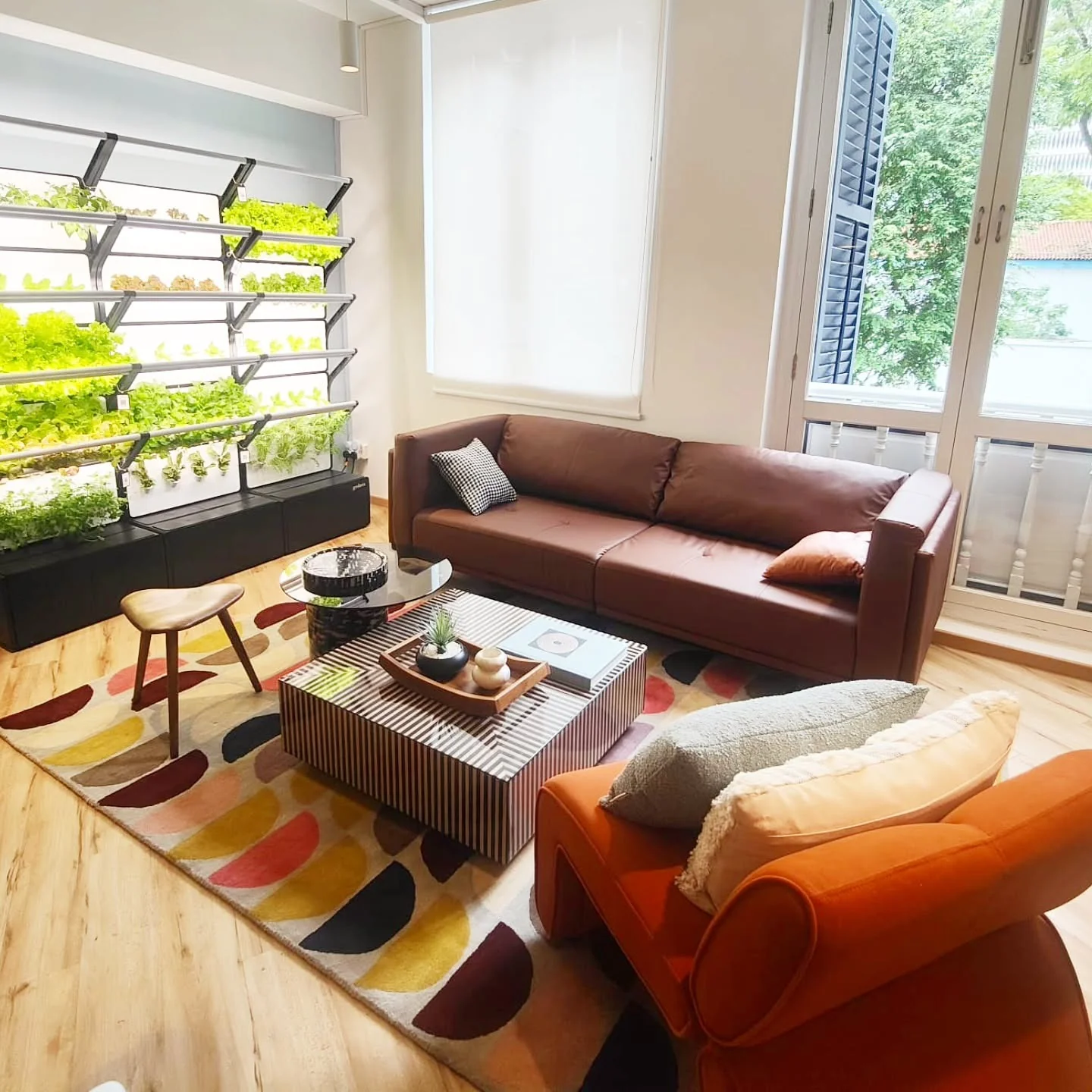 8. Playful Mid-Mod with a Touch of Whimsy (Brown Leather Sofa Living Room Ideas)