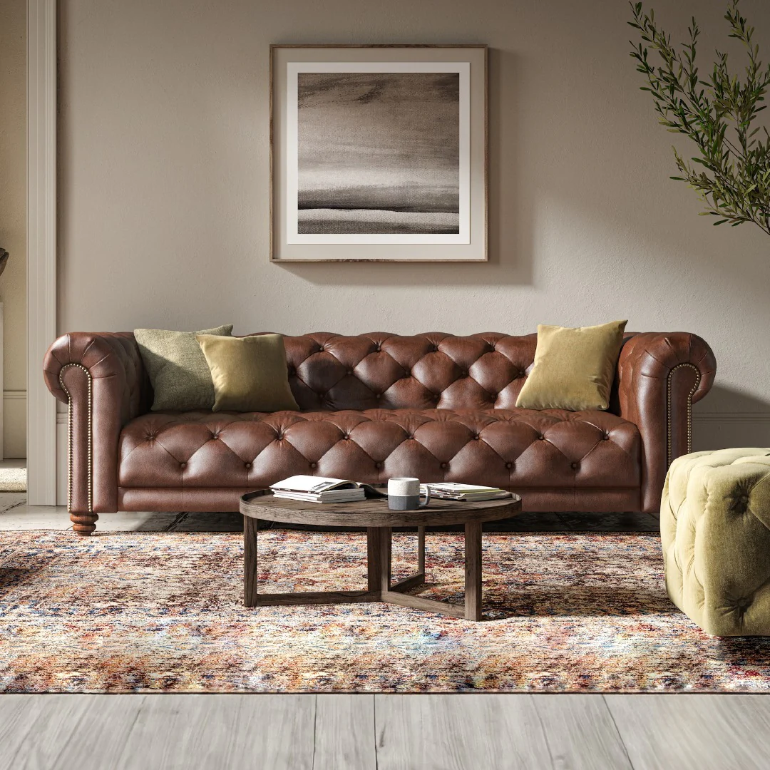 12. Heritage Elegance with Tufted Texture (Brown Leather Sofa Living Room Ideas)