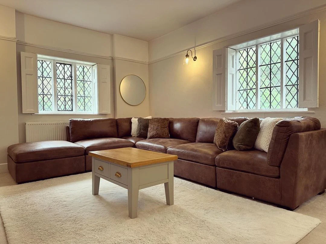 11. Classic Comfort in Soft Neutrals (Brown Leather Sofa Living Room Ideas)