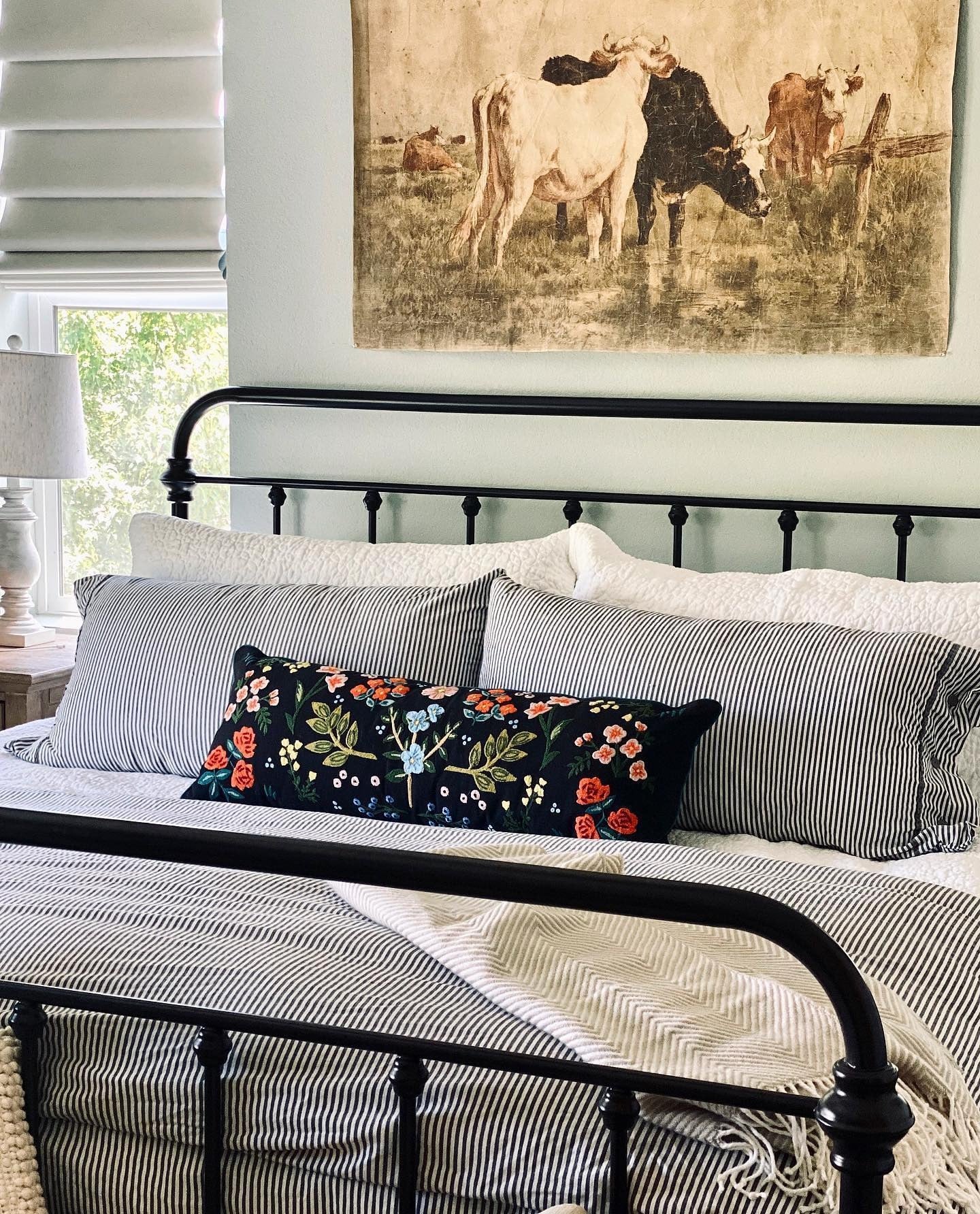 12. Farmhouse Texture with Embroidered Accent (Metal Bed Frame Bedroom Ideas)