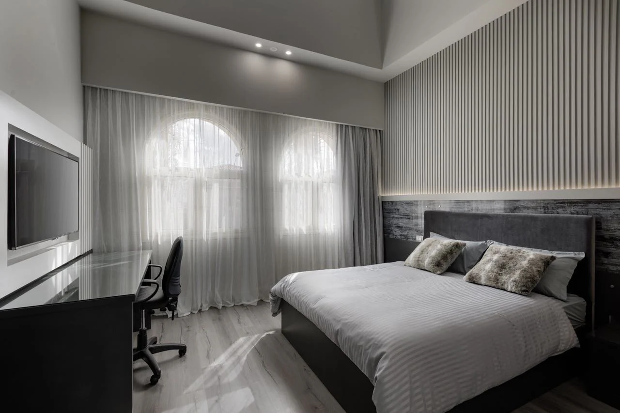 6. Sculptural Minimalism with Vertical Rhythm (Gray Wall Bedroom Ideas)