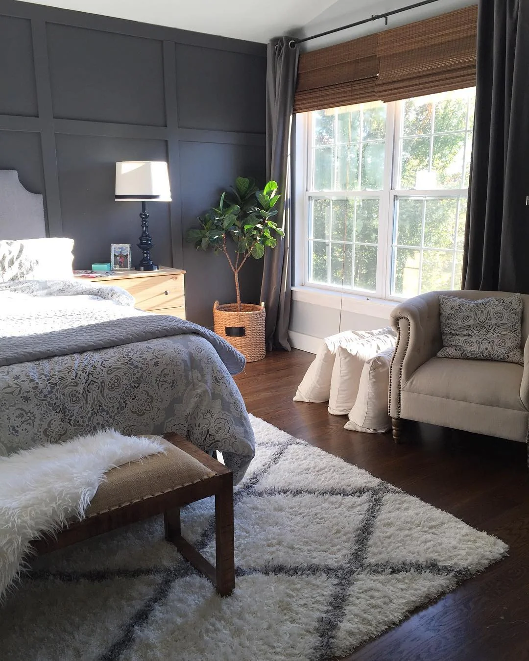 8. Dark and Moody Meets Natural Light (Gray Wall Bedroom Ideas)