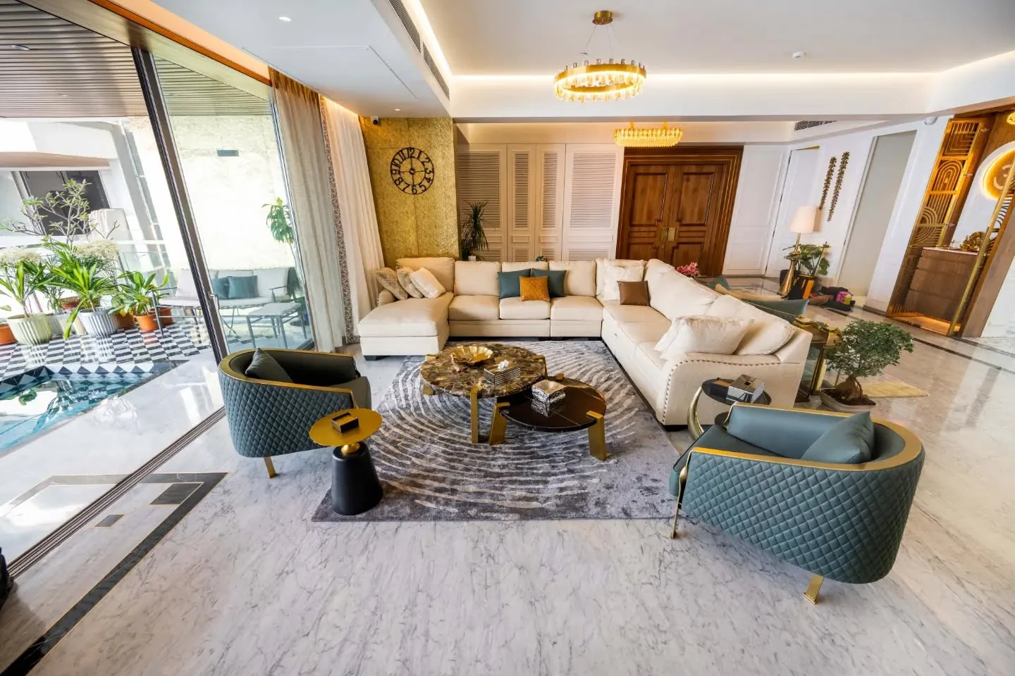 10. Contemporary Grandeur with Mixed Metals (Gold Living Room Ideas)