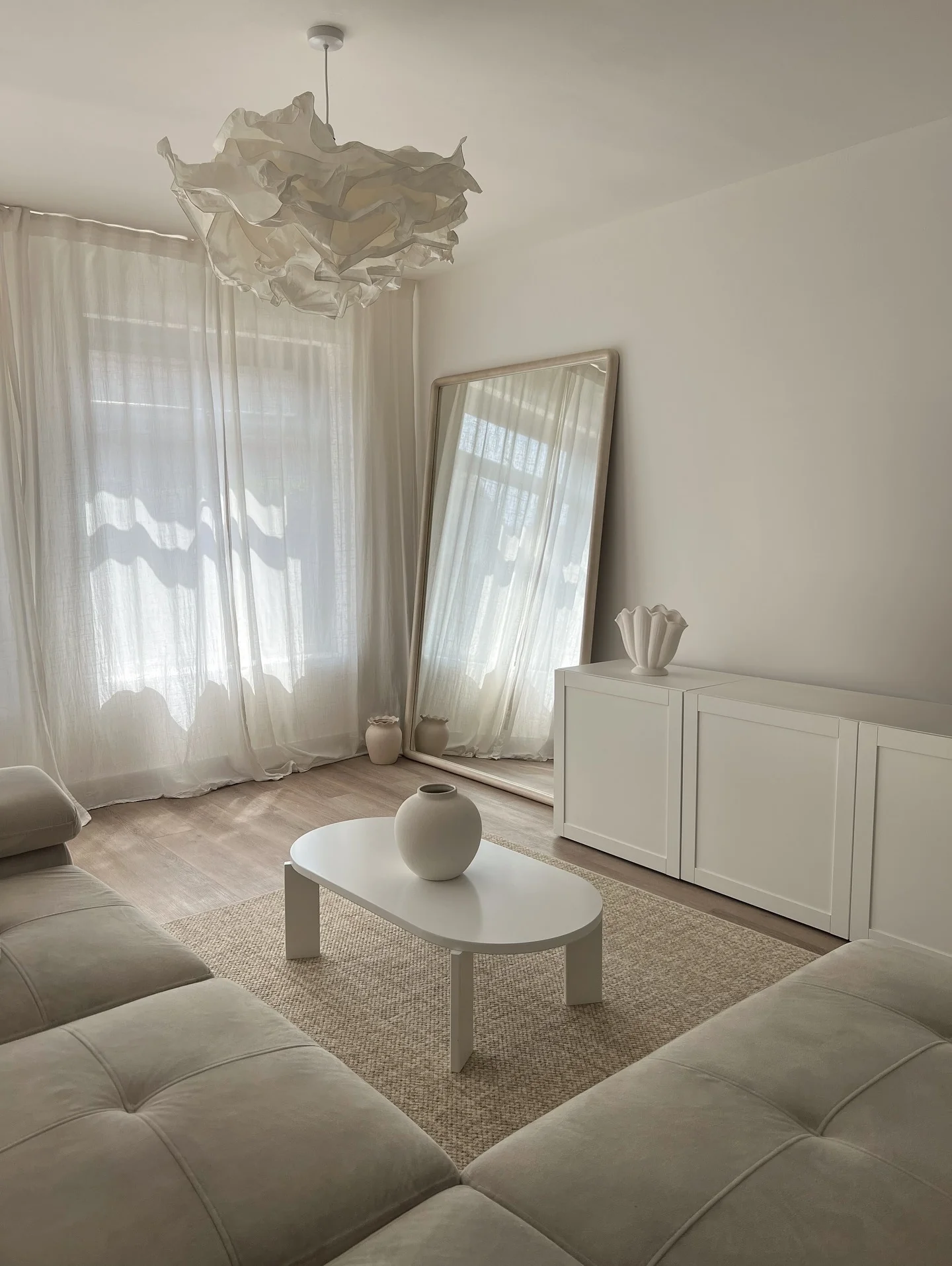 7. Minimal All-White with Organic Textures (Living Room Mirror Ideas)