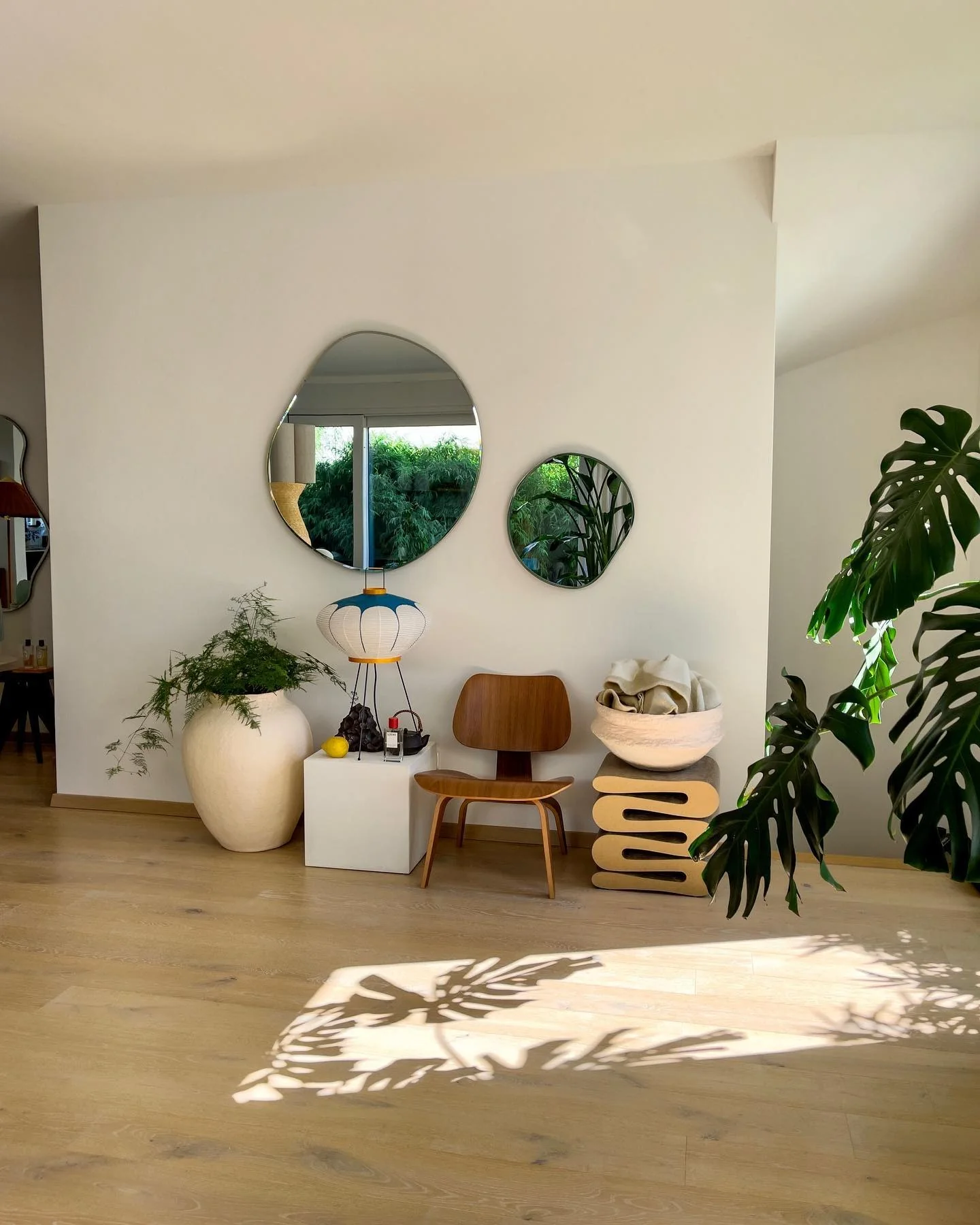 9. Playful Modern with Sculptural Touches (Living Room Mirror Ideas)