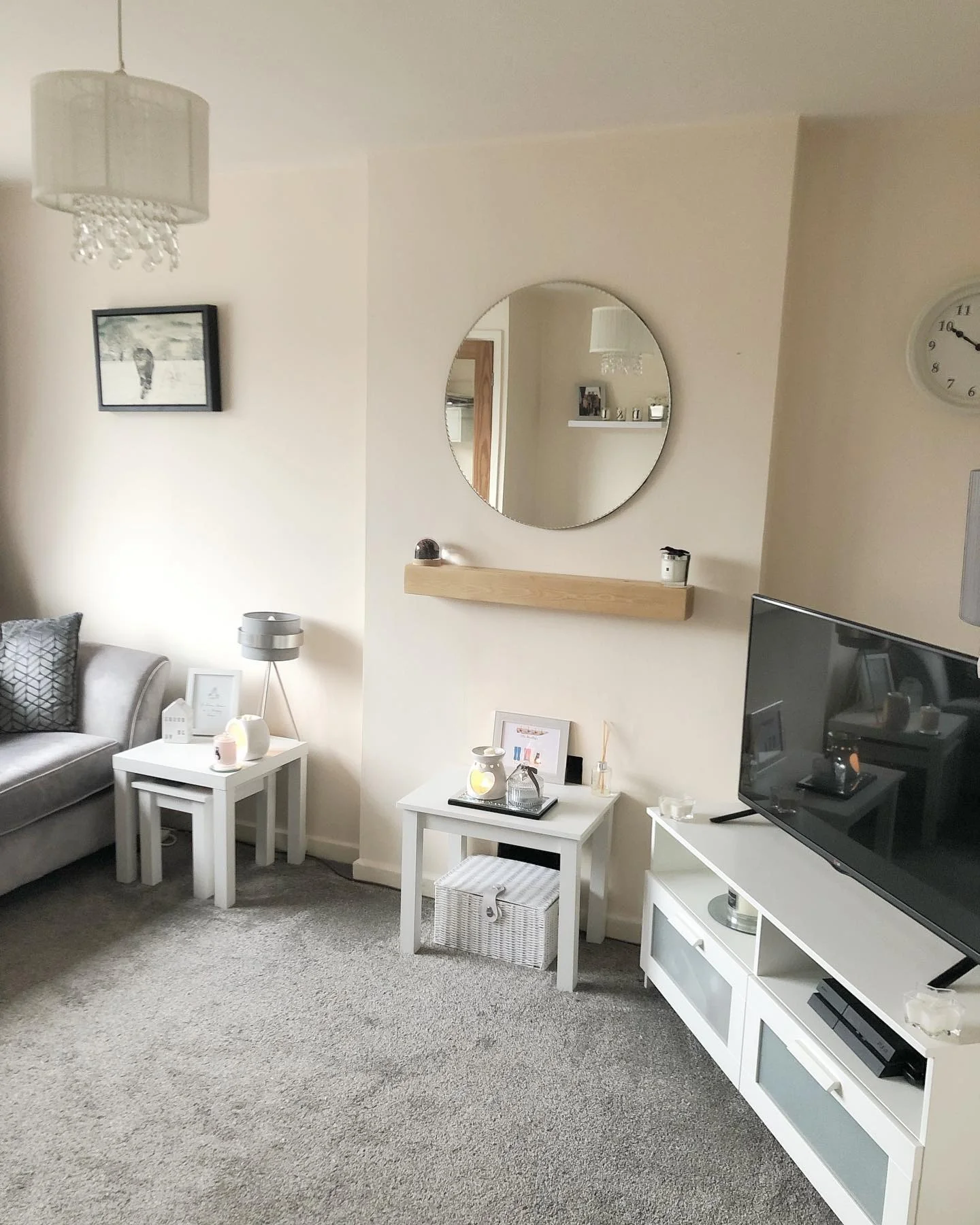 13. Simple Symmetry with Floating Shelf Accent (Living Room Mirror Ideas)