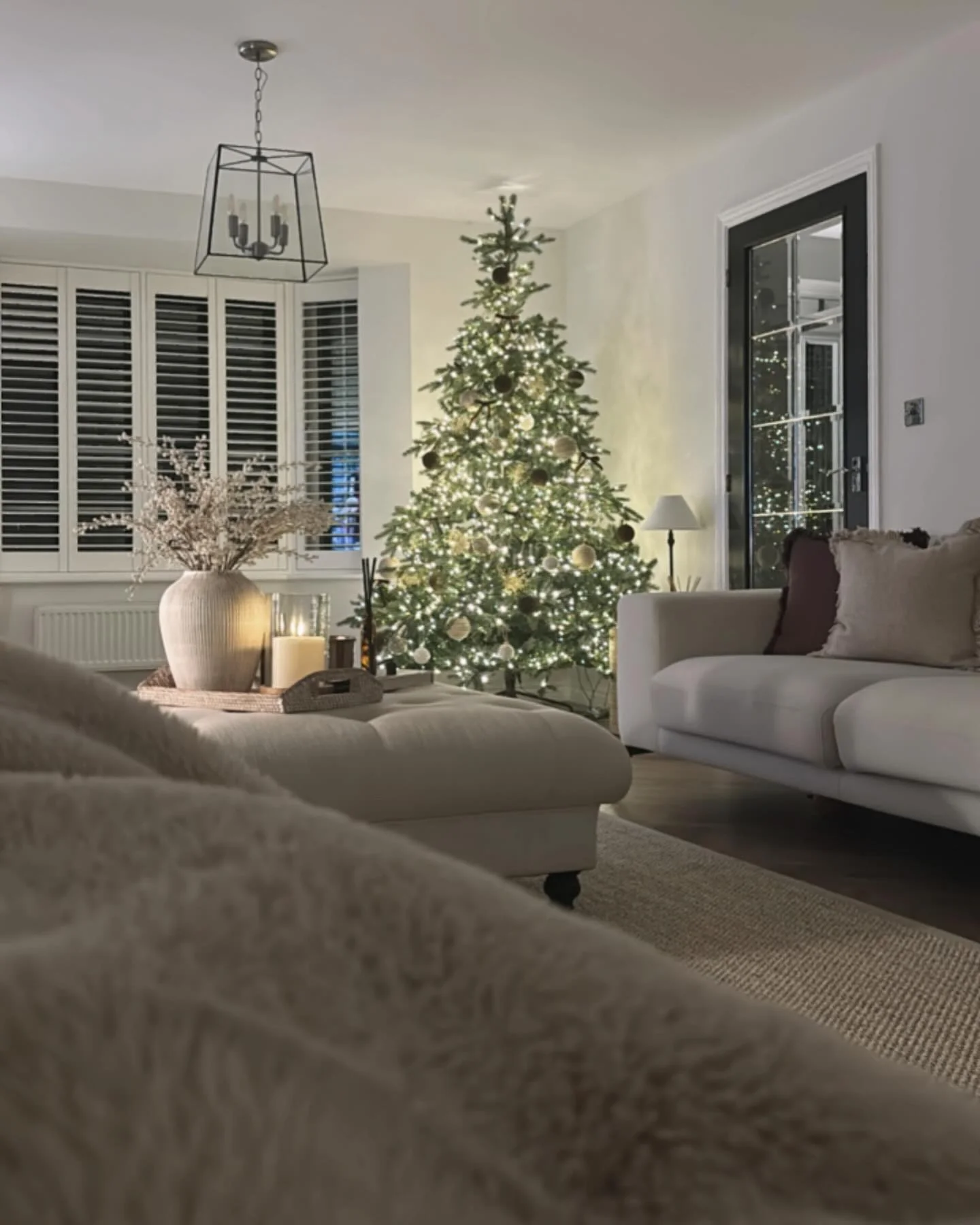 12. Modern Glow in Cream and Charcoal Neutrals (Christmas Living Room Decor Ideas)