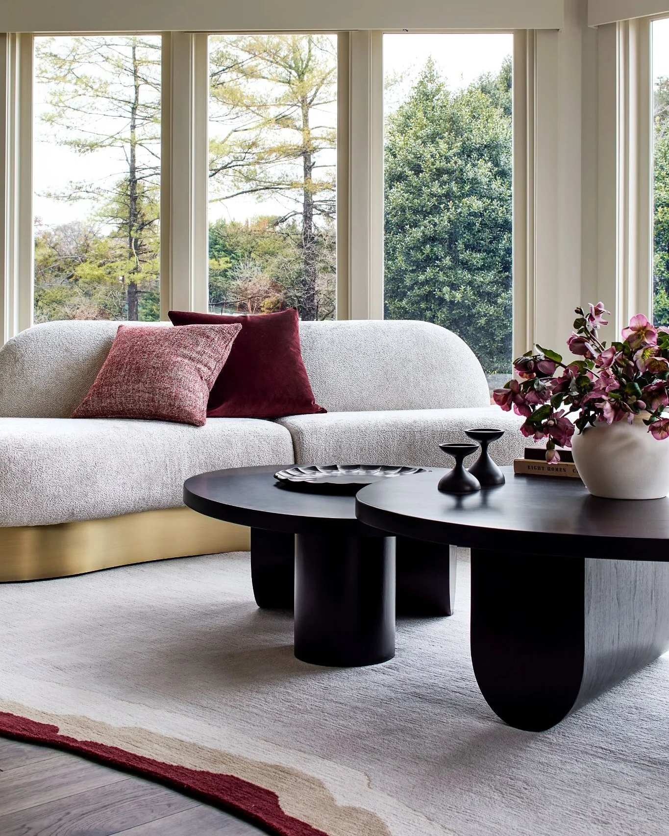 2. Modern Chic with Burgundy Accents (Black Furniture Living Room Ideas)