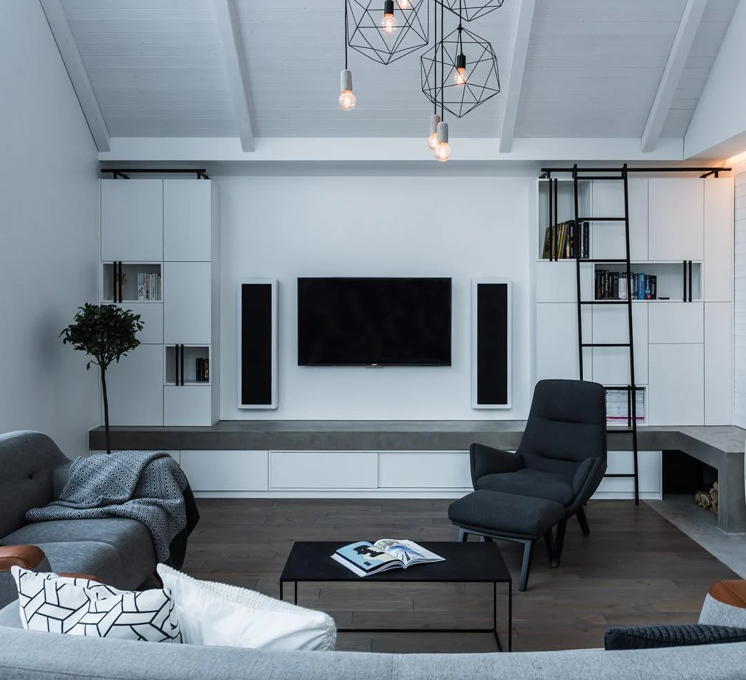 8. Sculpted Simplicity with Geometric Details (Black Furniture Living Room Ideas)