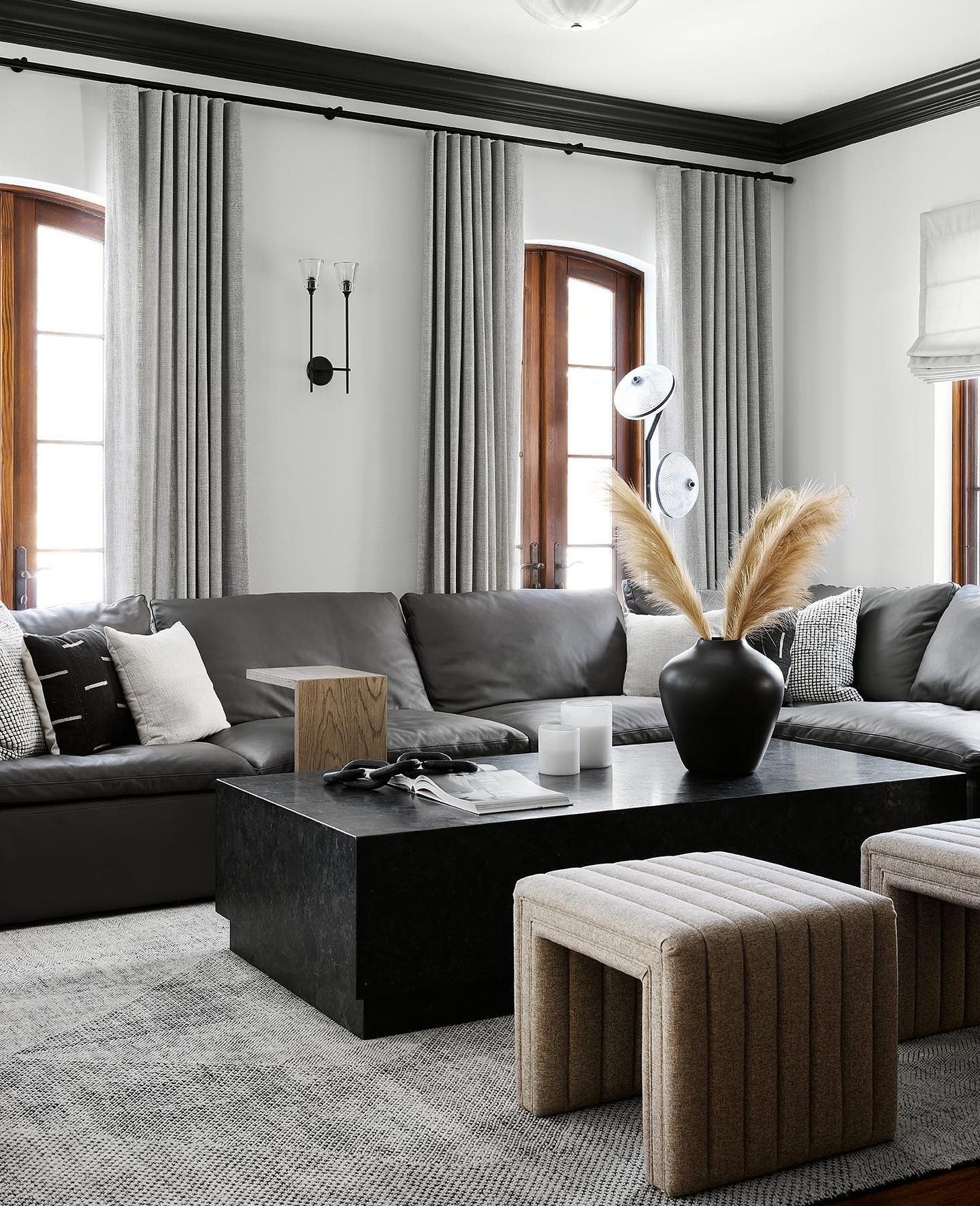 7. Bold Monochrome with Natural Textures (Black Furniture Living Room Ideas)