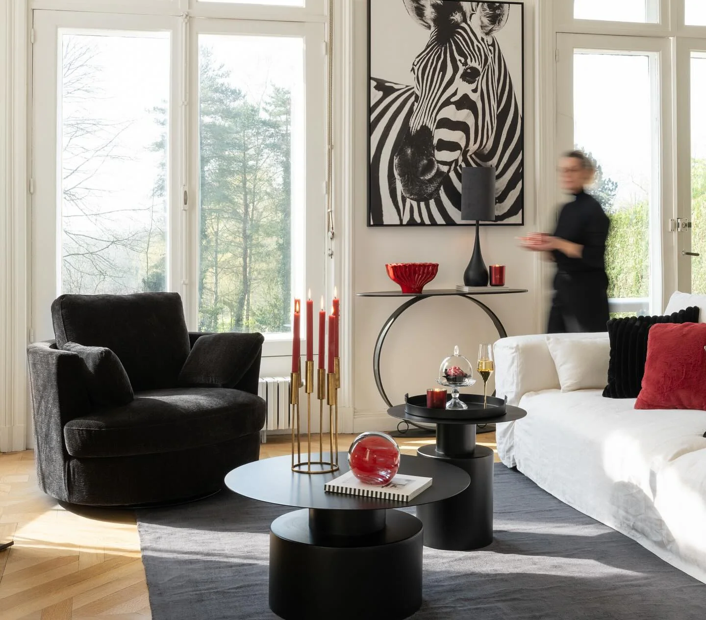 14. Bold Graphic Accents with Red Highlights (Black Furniture Living Room Ideas)