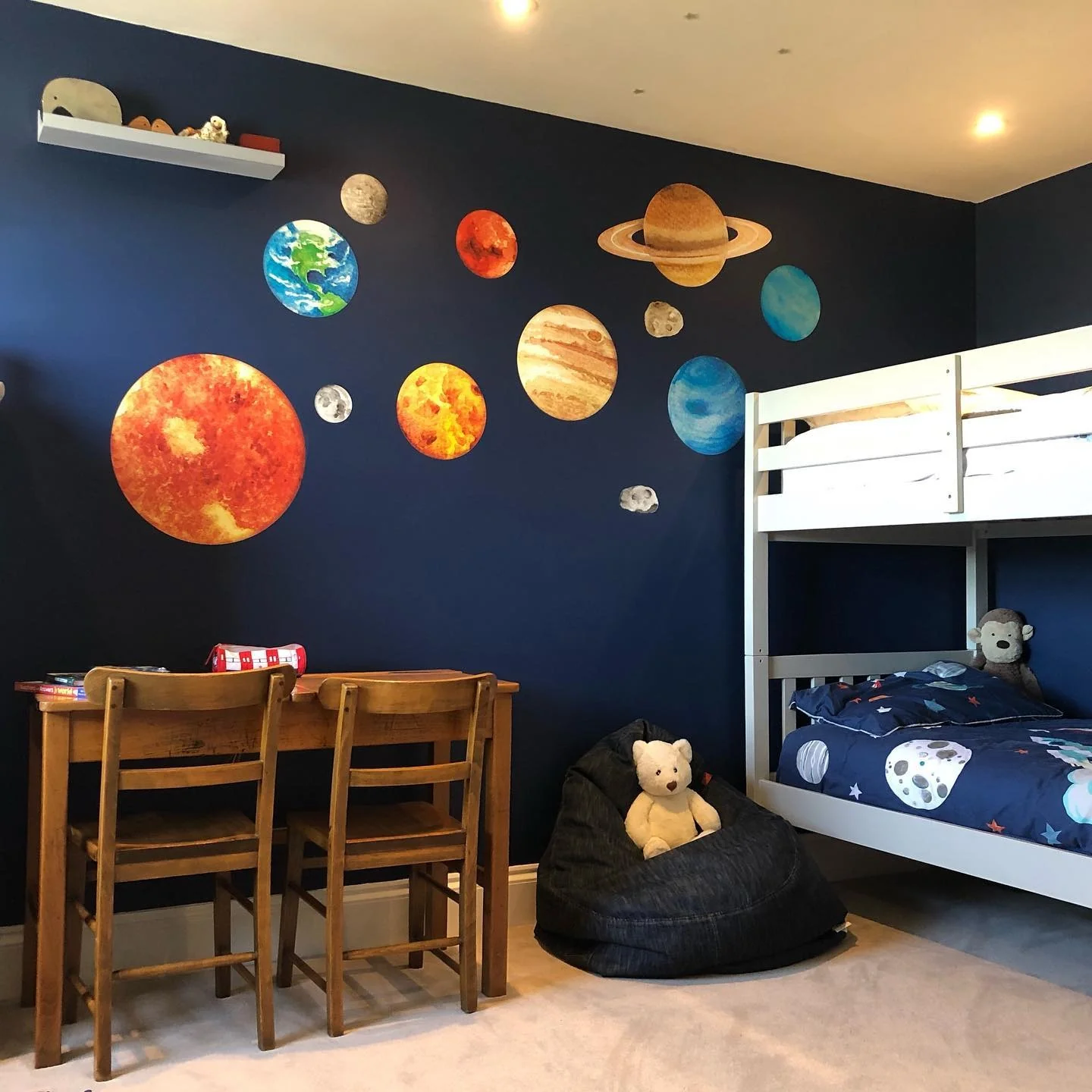 8. Bold Planet Wall and Bunk Bed Setup (Space Bedroom Ideas)