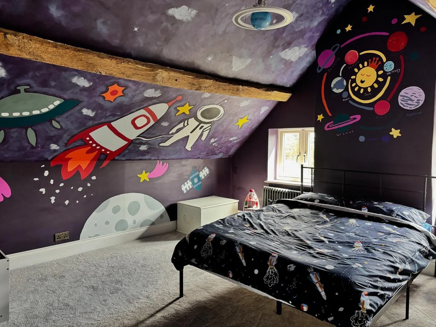 12. Cosmic Storybook Loft with Bold Murals (Space Bedroom Ideas)