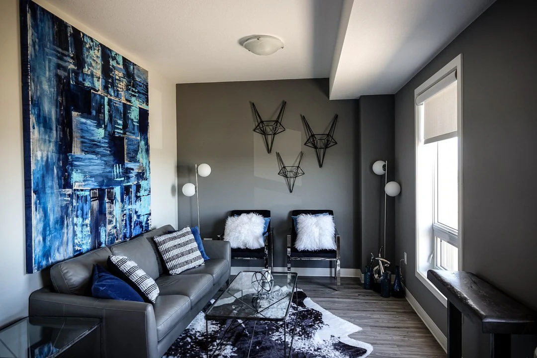 6. Moody Elegance with Sapphire and Steel (Dark Grey Living Room Ideas)