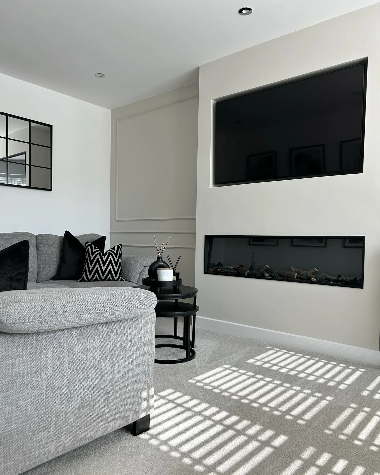 13. Matte Grey Elegance with Graphic Accents (Dark Grey Living Room Ideas)