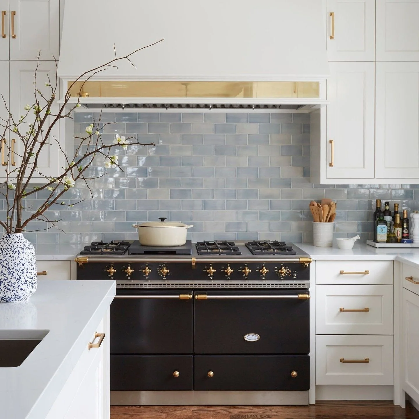 9. Classic European Flair with Pale Blue Gloss (Blue Backsplash Kitchen Ideas)