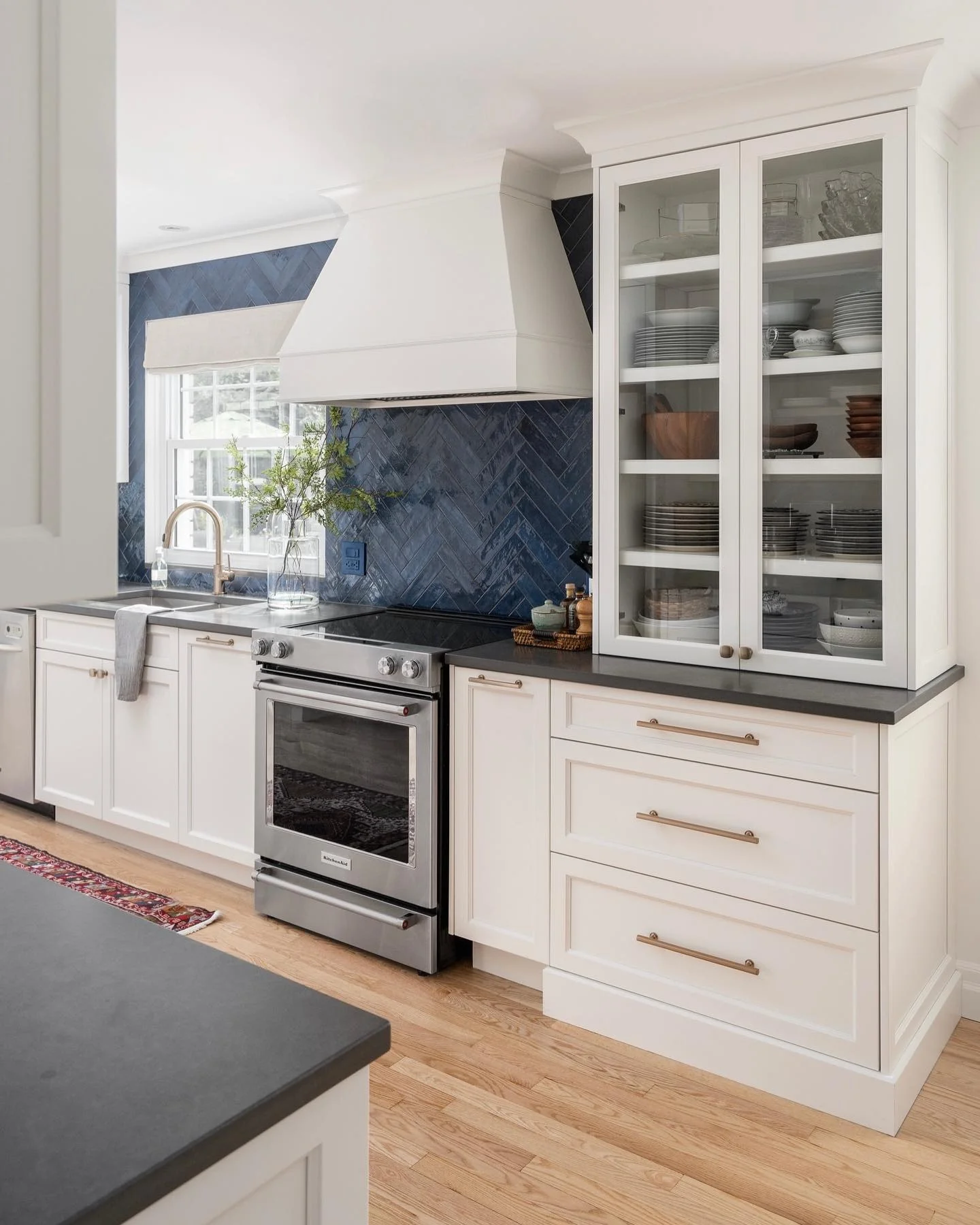 12. Midnight Chevron with Soft Ivory Cabinetry (Blue Backsplash Kitchen Ideas)