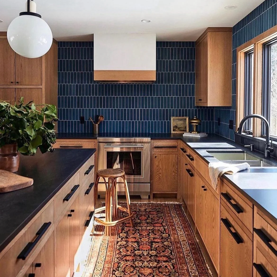 17. Vertical Indigo Tile with Natural Oak Cabinets (Blue Backsplash Kitchen Ideas)