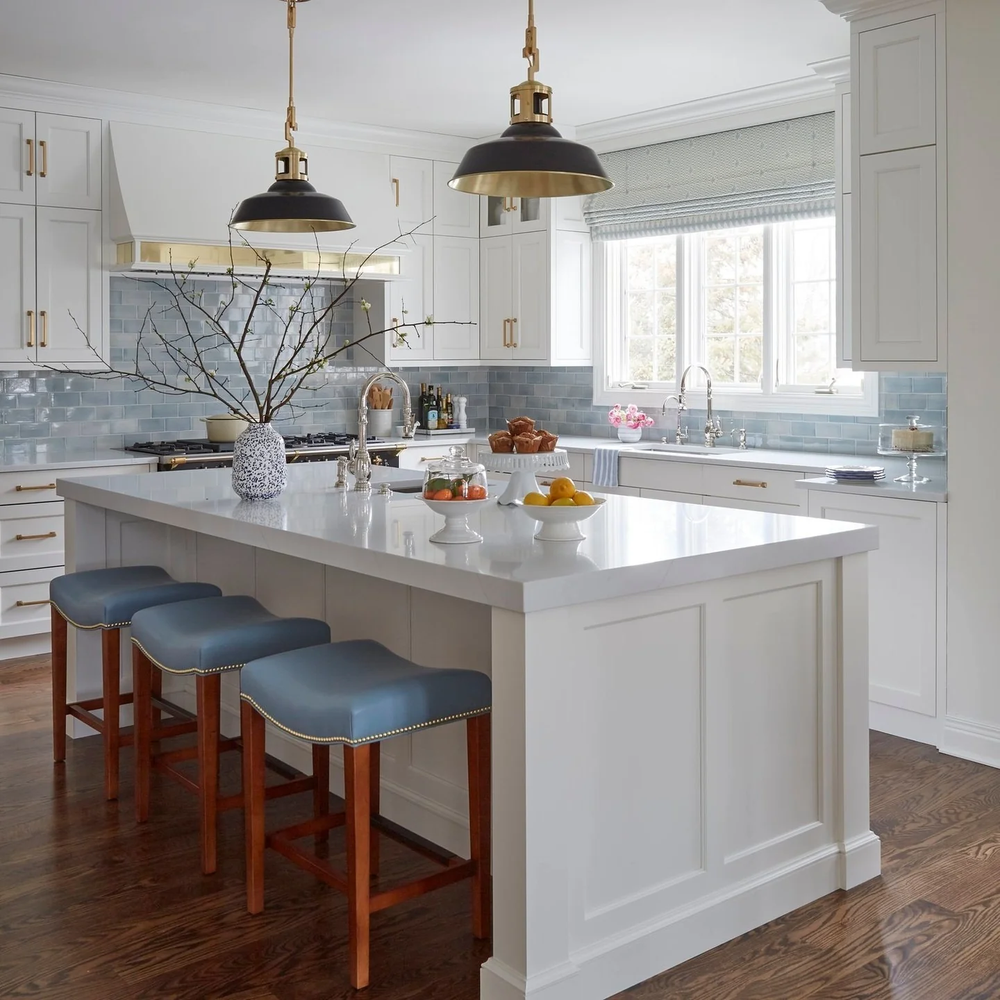 16. Icy Gloss Tile with White Paneling and Blue Seating (Blue Backsplash Kitchen Ideas)