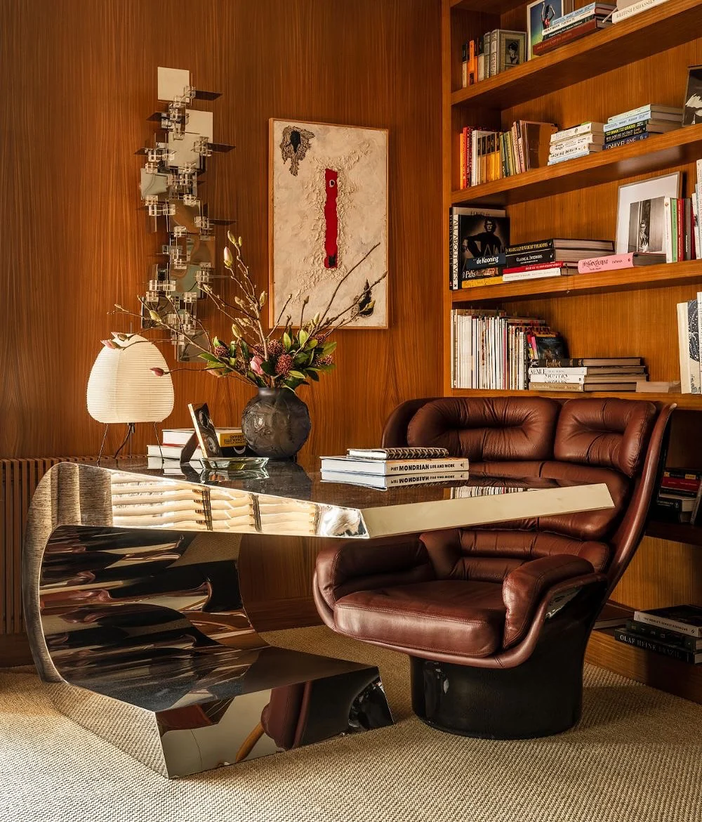 9. Retro Glam Library Office with Sculptural Chrome Desk (Old Money Office Ideas)