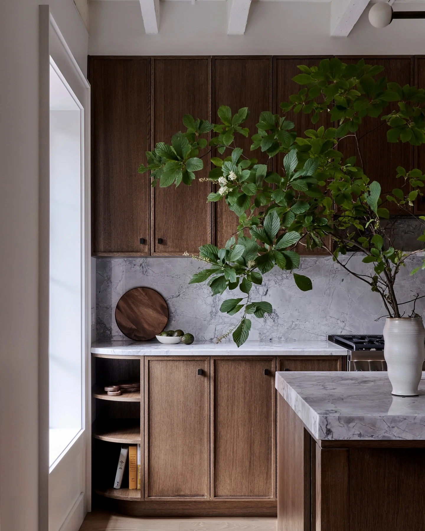 5. Refined Simplicity with Organic Layers (Dark Wood Kitchen Ideas)