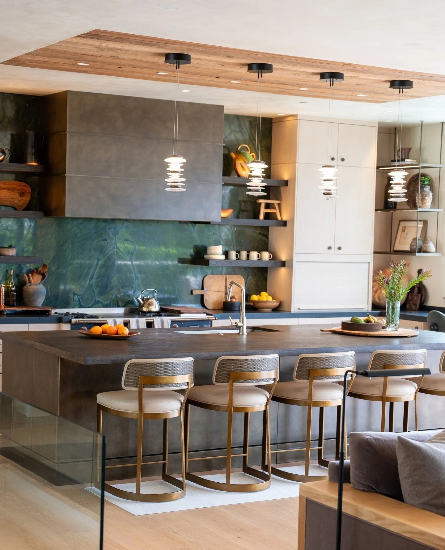 4. Modern Organic with Deep Green Stone and Warm Brass (Living Room and Kitchen Ideas)