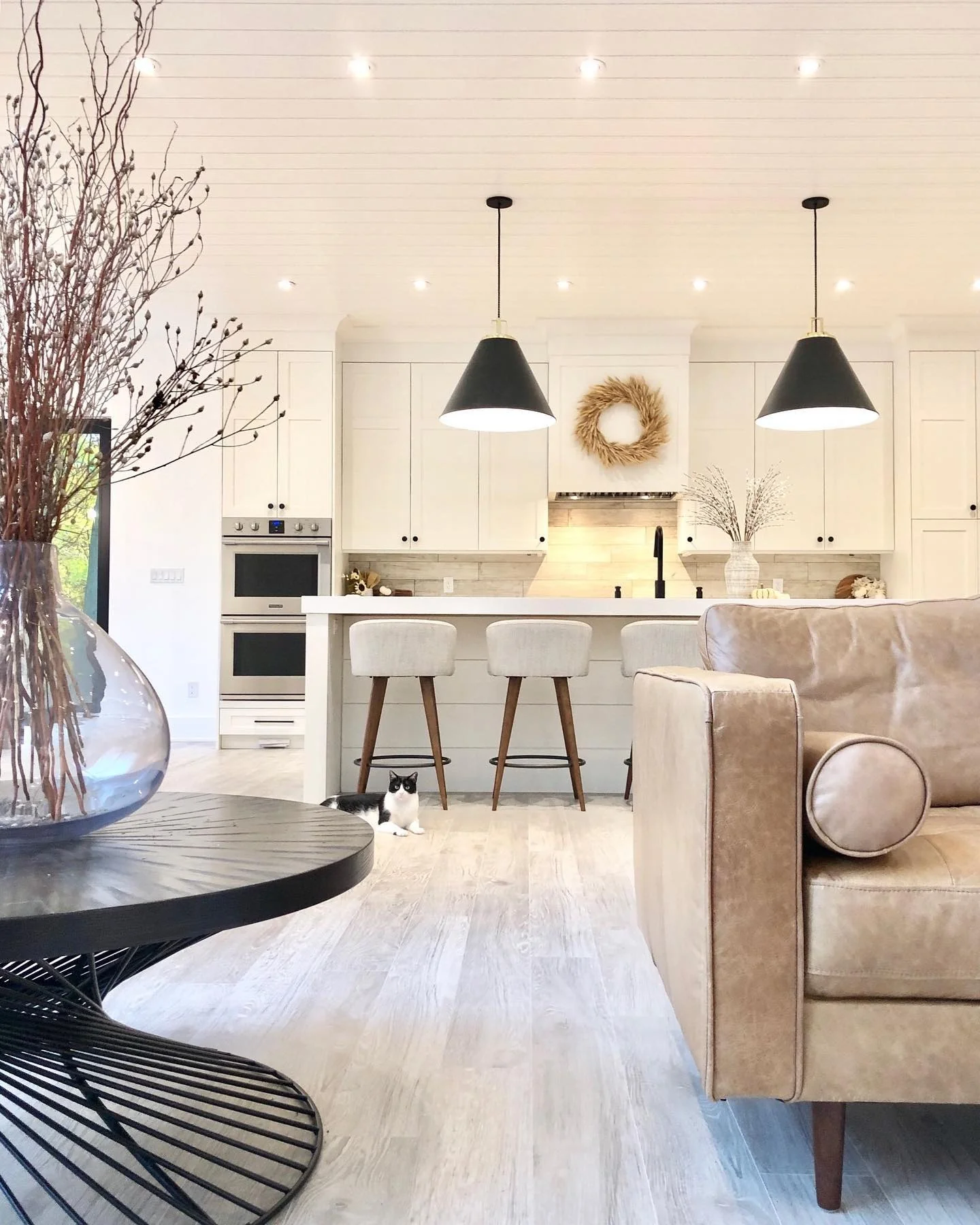 5. Transitional Style with Neutral Tones and Layered Lighting (Living Room and Kitchen Ideas)