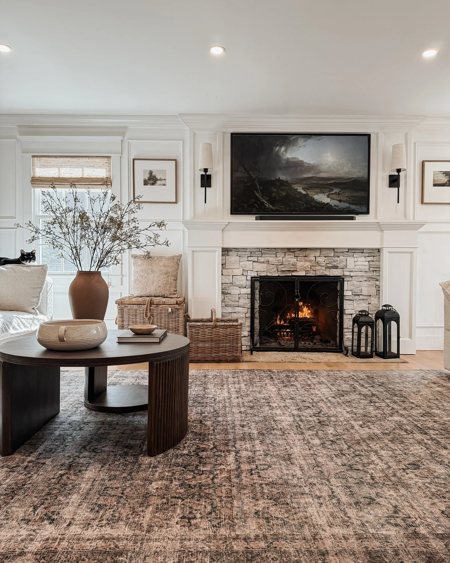 6. Stone Hearth Elegance in Traditional Framing (Accent Wall Ideas for Living Room)