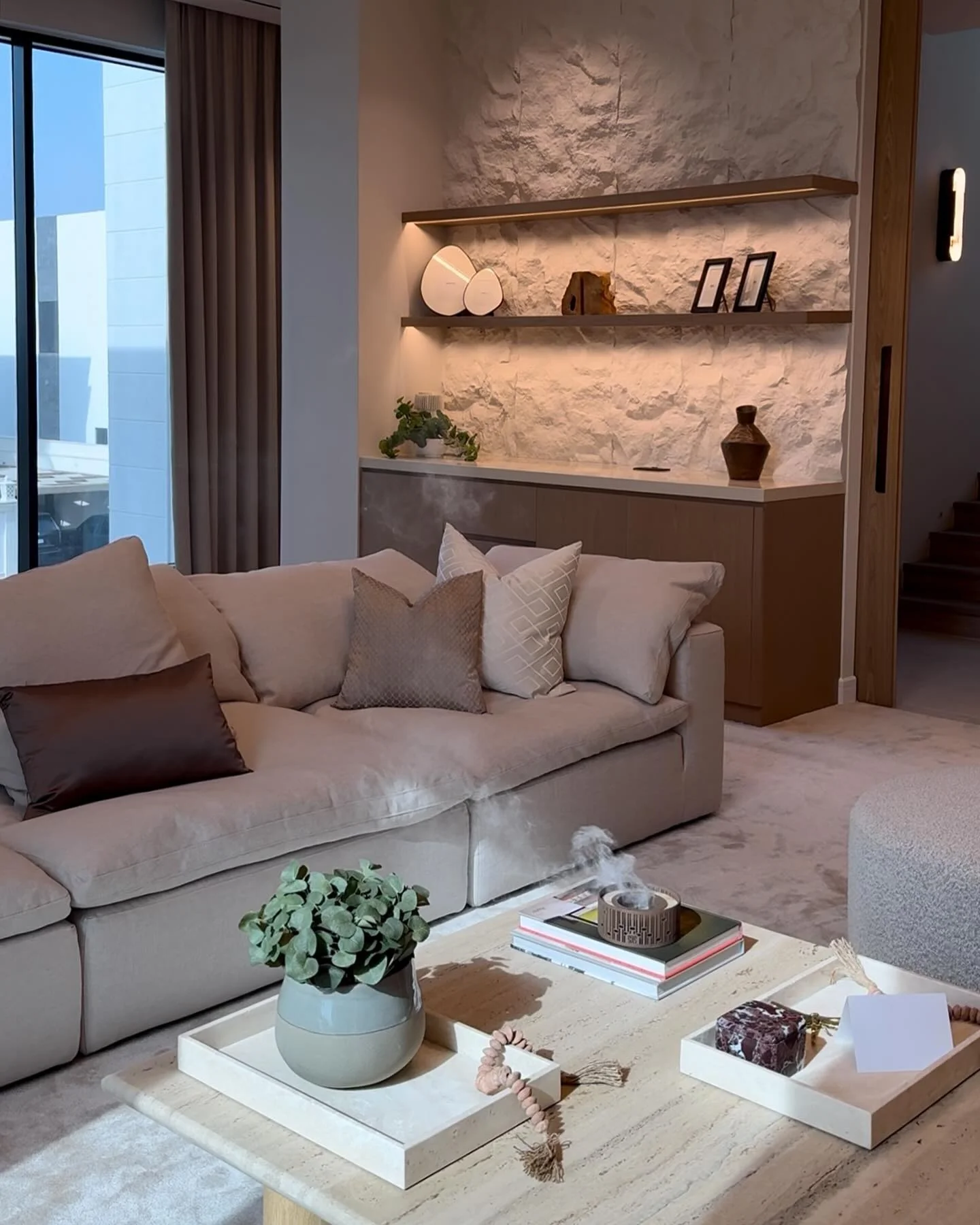 8. Subtle Texture with Soft Stone Illumination (Accent Wall Ideas for Living Room)