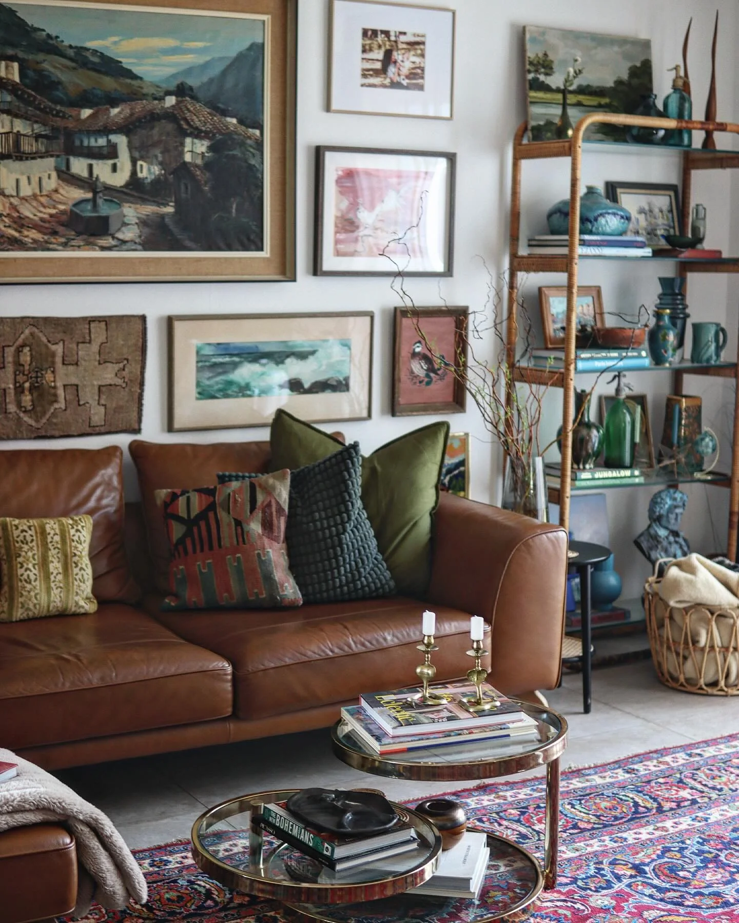 11. Warm Earth Tones with Collected Heritage (Gallery Wall Living Room Ideas)