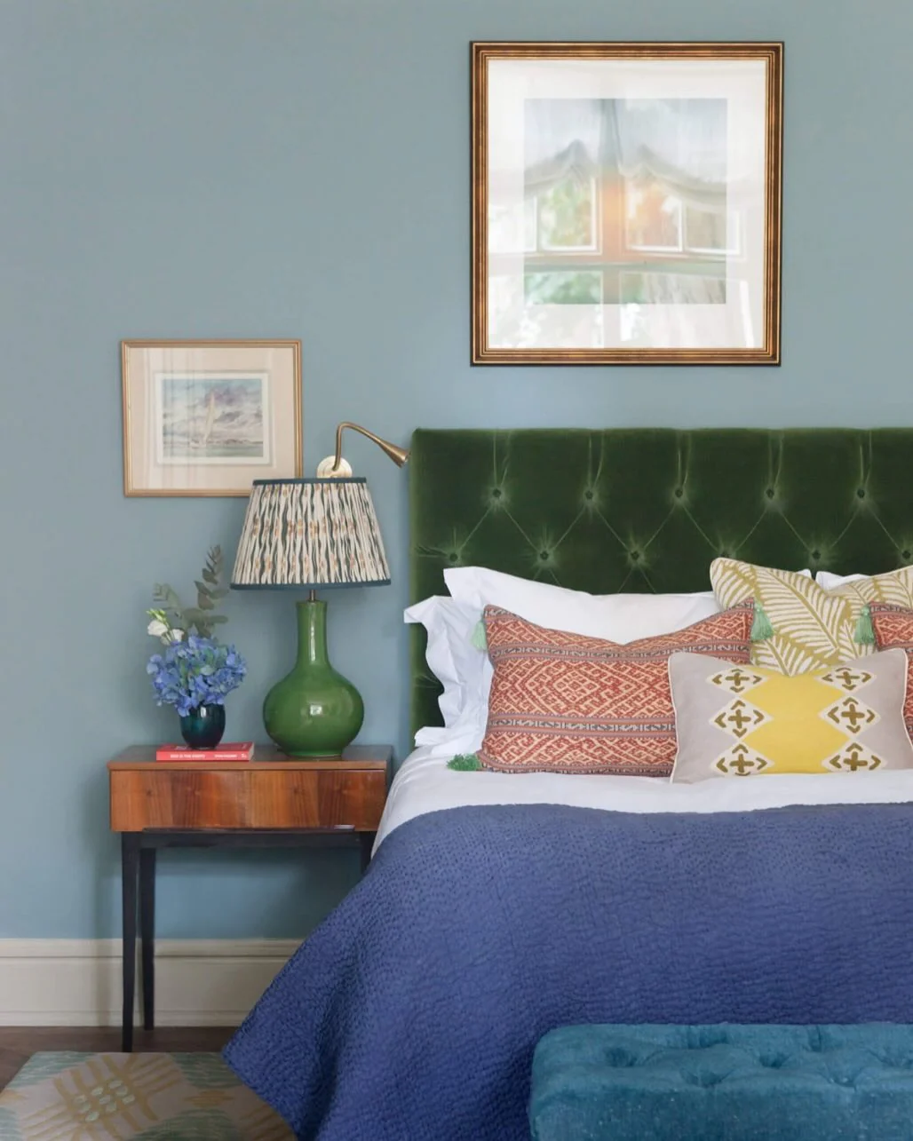14. Moody Blue Walls with Rich Green Velvet (Blue and Green Bedroom Ideas)