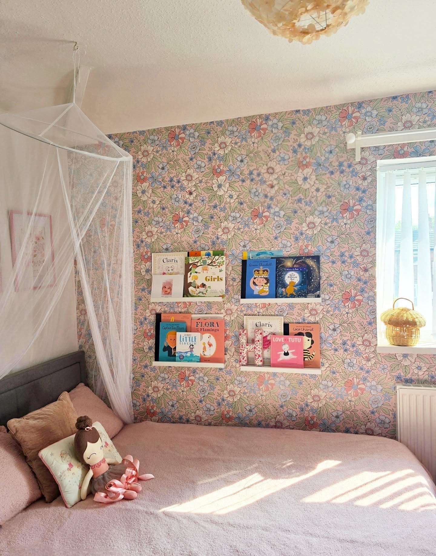 6. Floral Library Wall with Pastel Harmony (childrens bedroom ideas)
