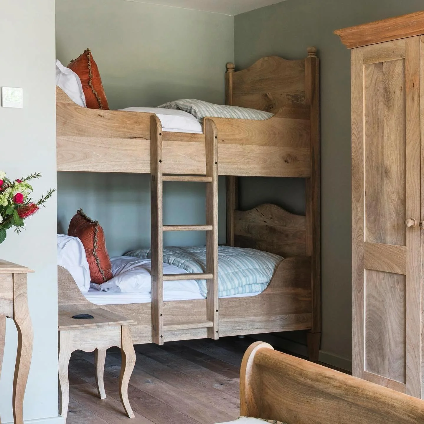 16. Rustic Charm with Carved Oak Bunk Beds (childrens bedroom ideas)