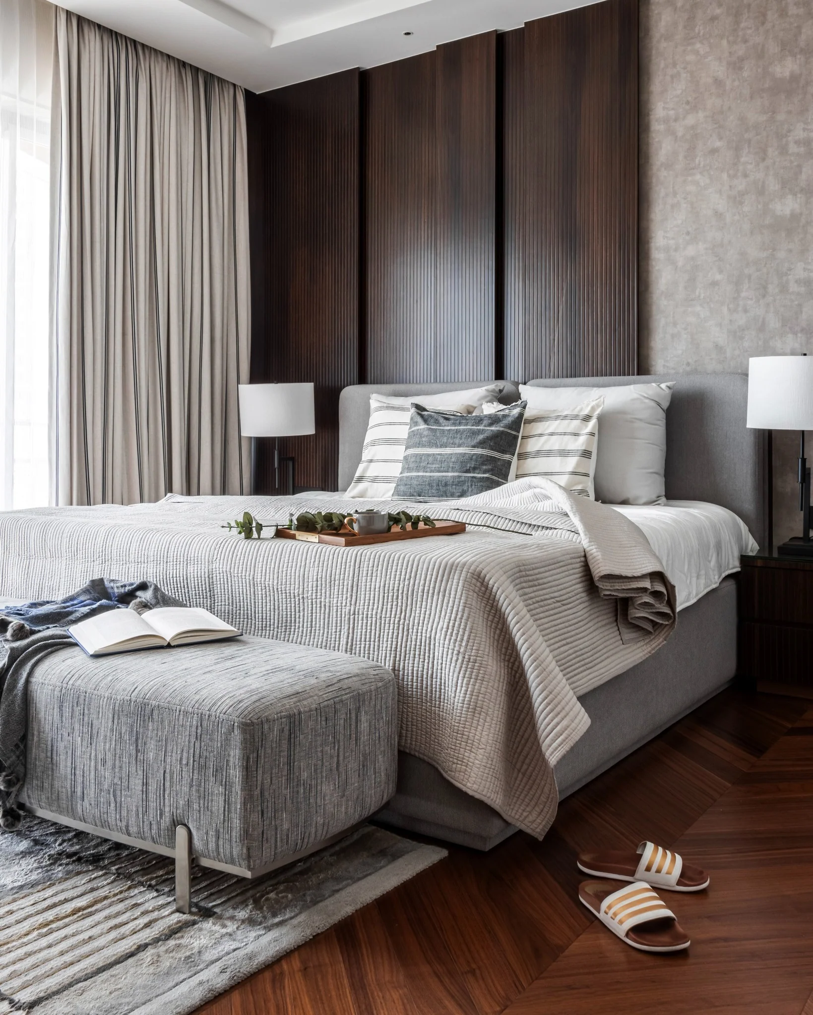 7. Tailored Neutrals with Vertical Panel Drama (Dark Wood Bedroom Ideas)