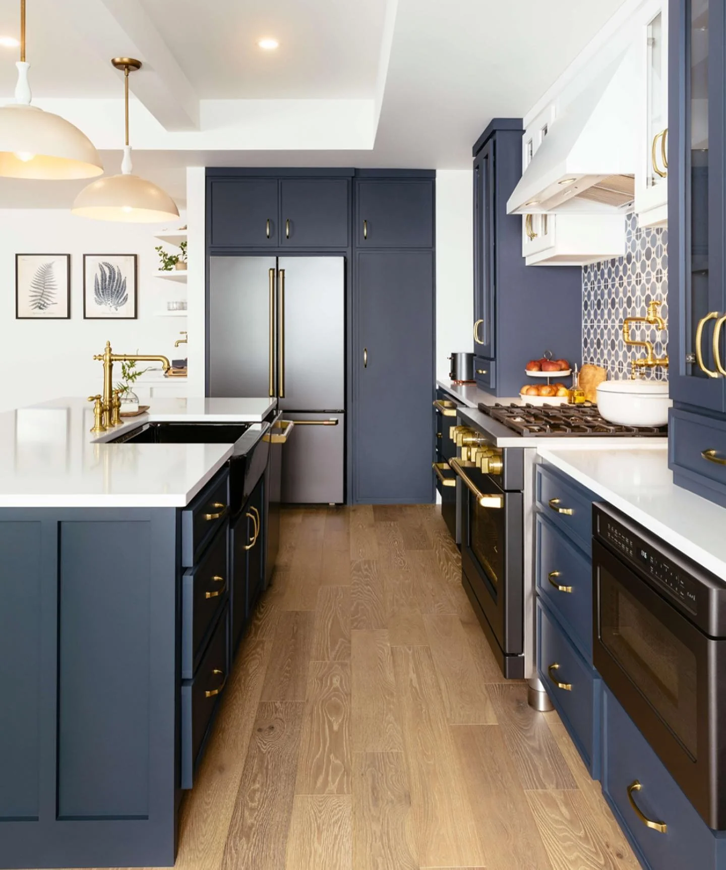 11. Navy Blue with Brass Accents and White Quartz (Kitchen Cabinet Color Ideas)