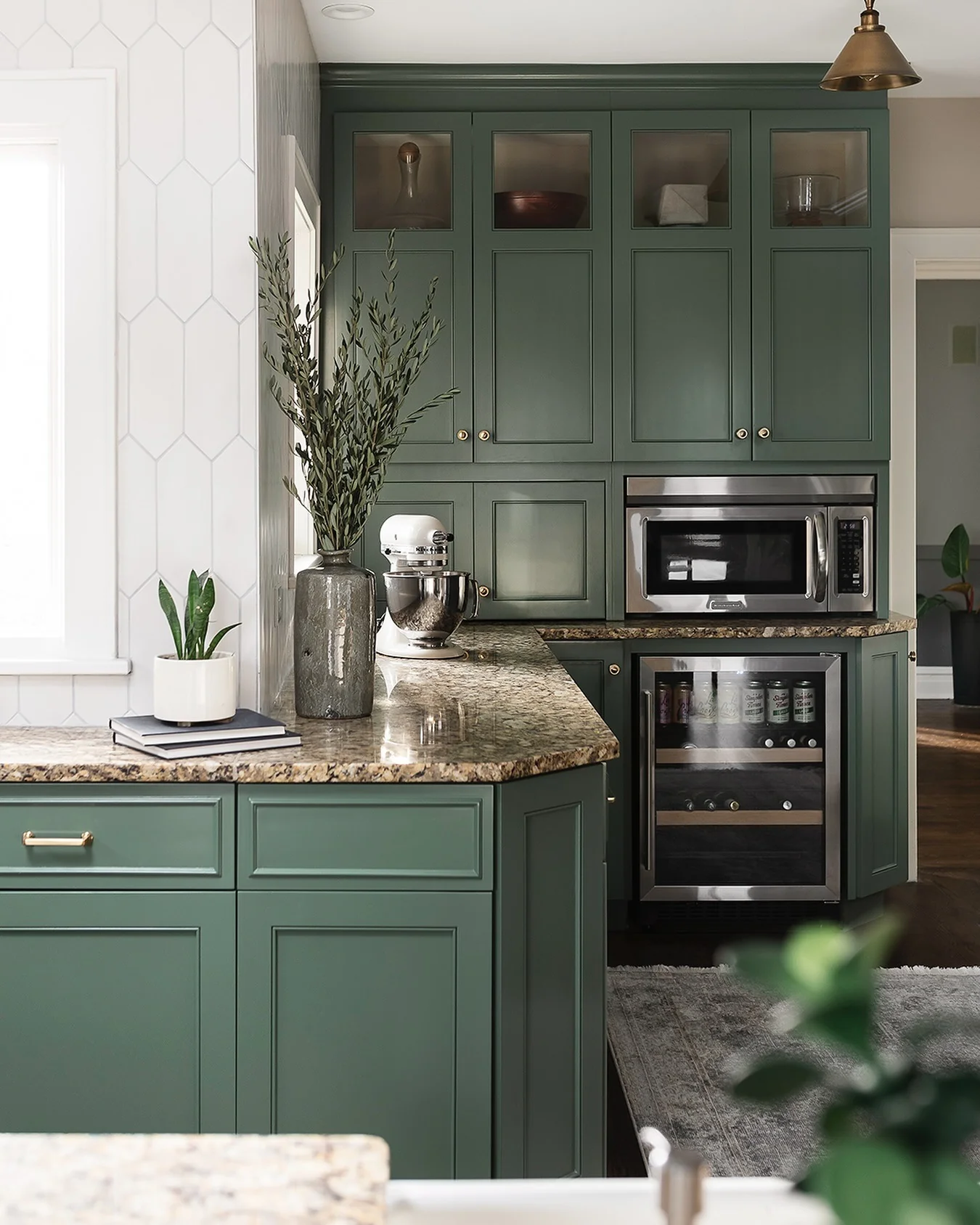12. Sage Green with Earth-Toned Granite (Kitchen Cabinet Color Ideas)