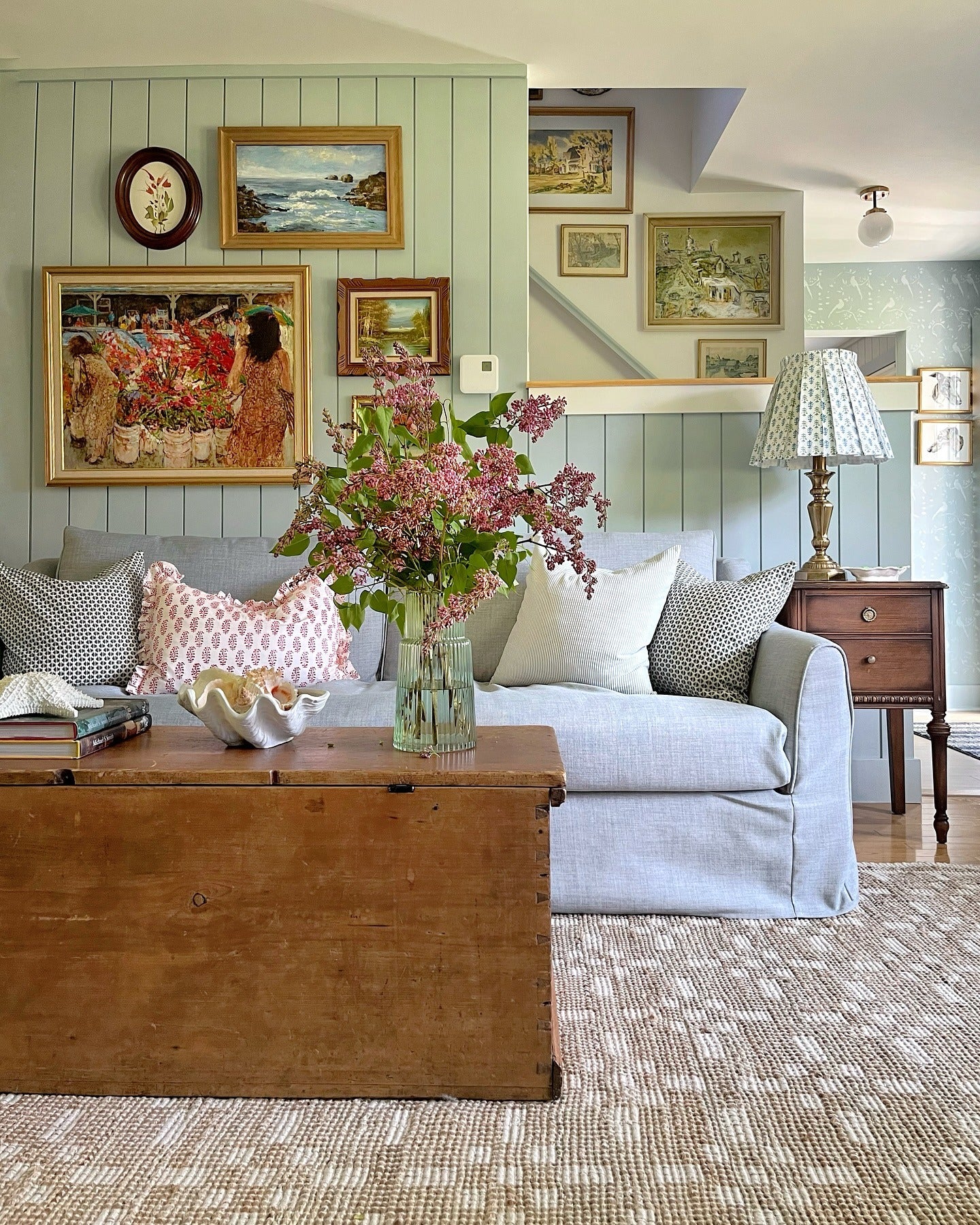 5. Eclectic Art and Botanical Accents (Sage Green Living Room Ideas)
