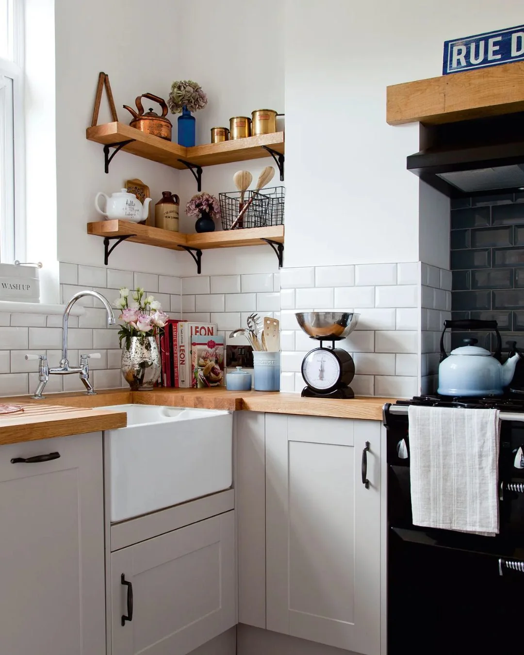 11. Compact French-Style Kitchen with Warm Wood and Vintage Brass (Small Cozy Kitchen Ideas)