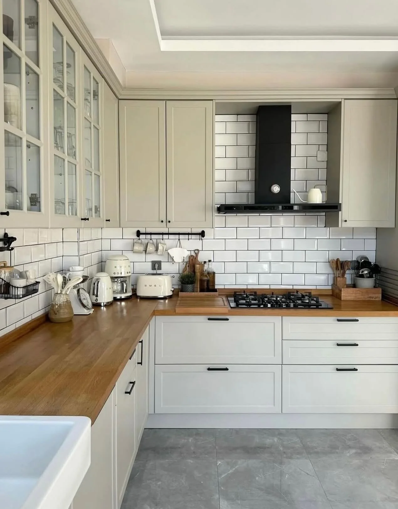 15. Modern Classic Kitchen with Soft Beige and Black Accents (Small Cozy Kitchen Ideas)