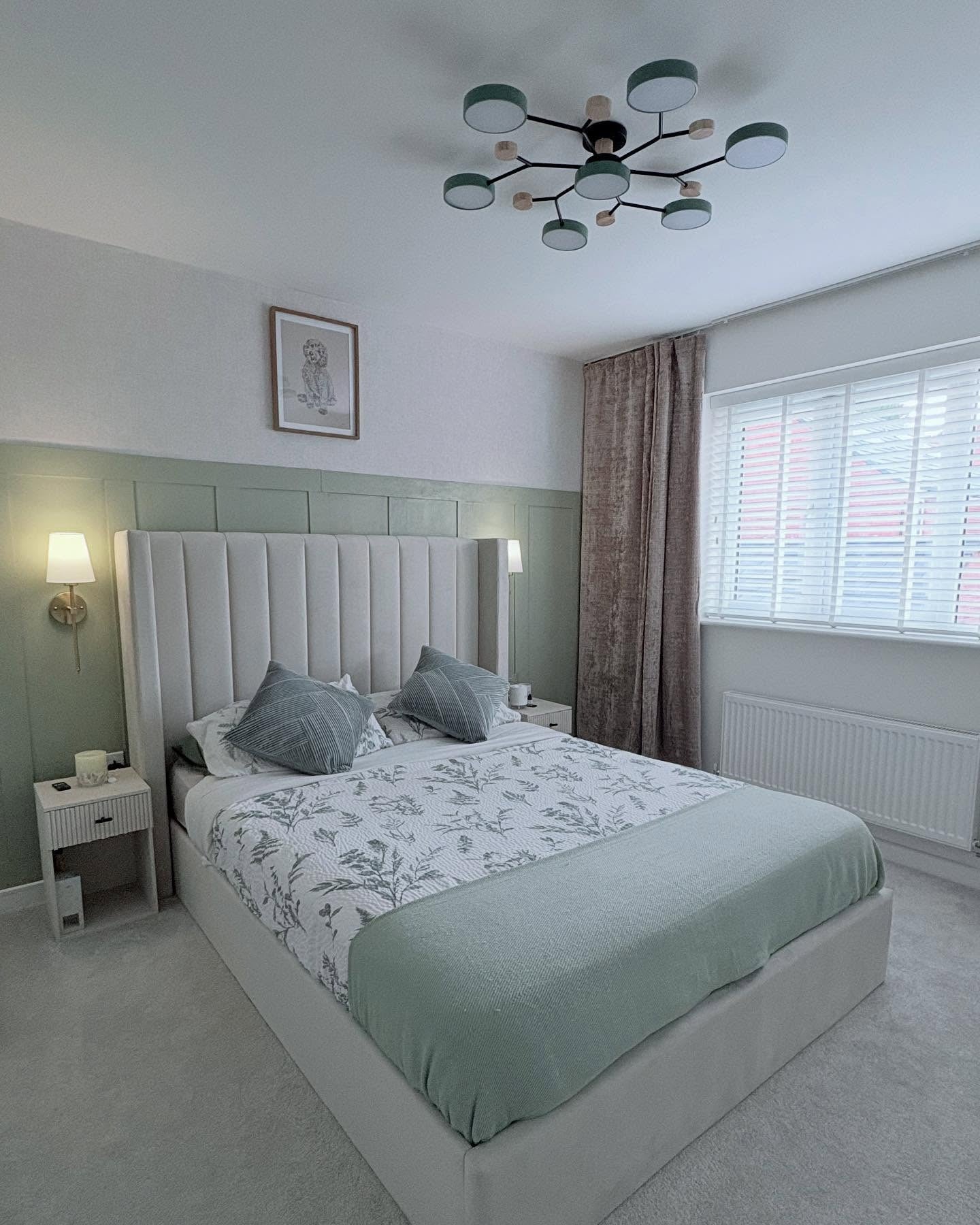 2. Refined Vertical Panel Elegance (Light Green Bedroom Ideas)