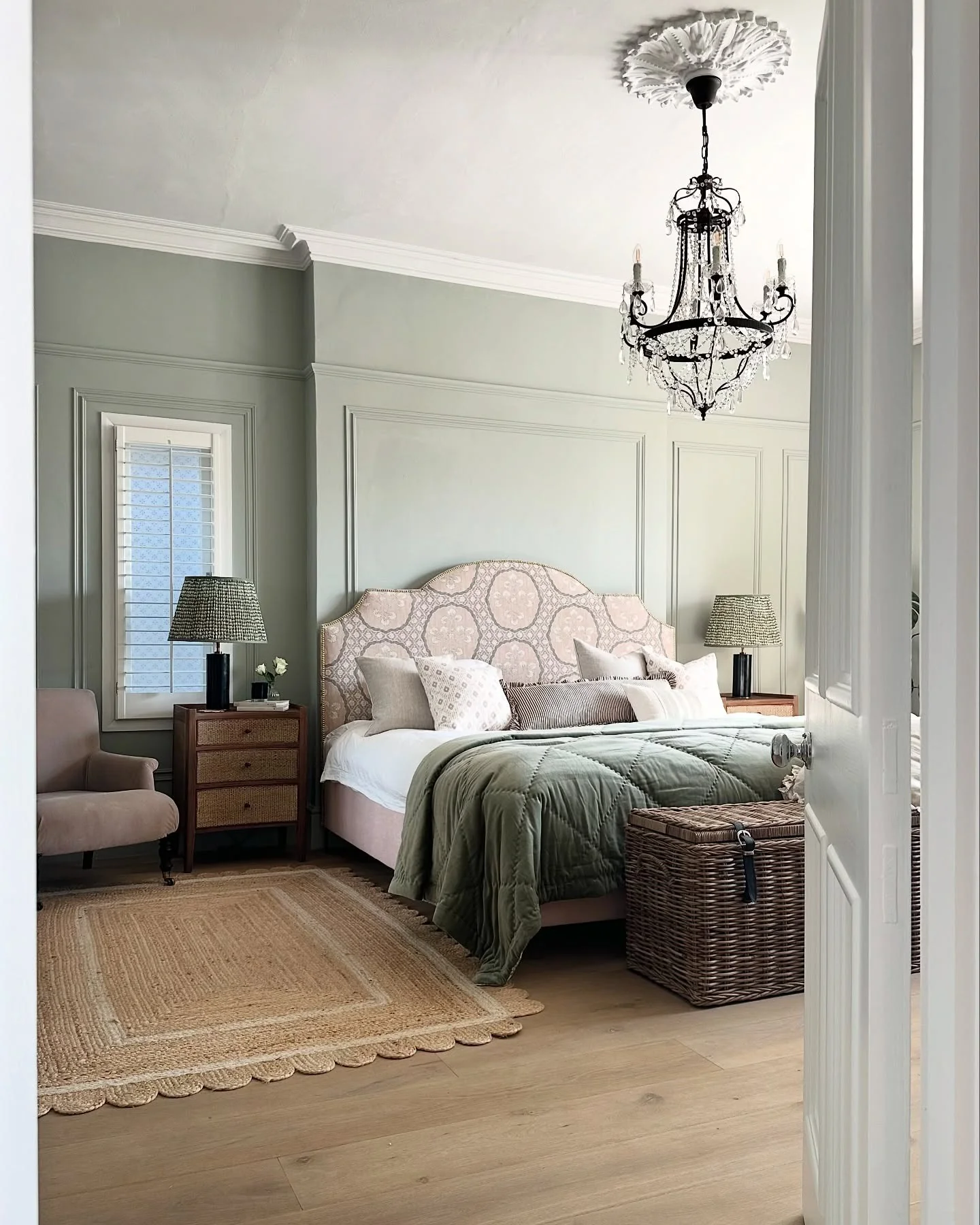 16. Pale Sage Elegance with Classic Molding (Light Green Bedroom Ideas)