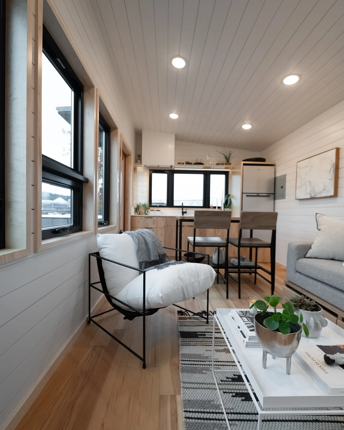 11. Linear Layout with Crisp White and Natural Wood (Tiny Living Room Ideas)