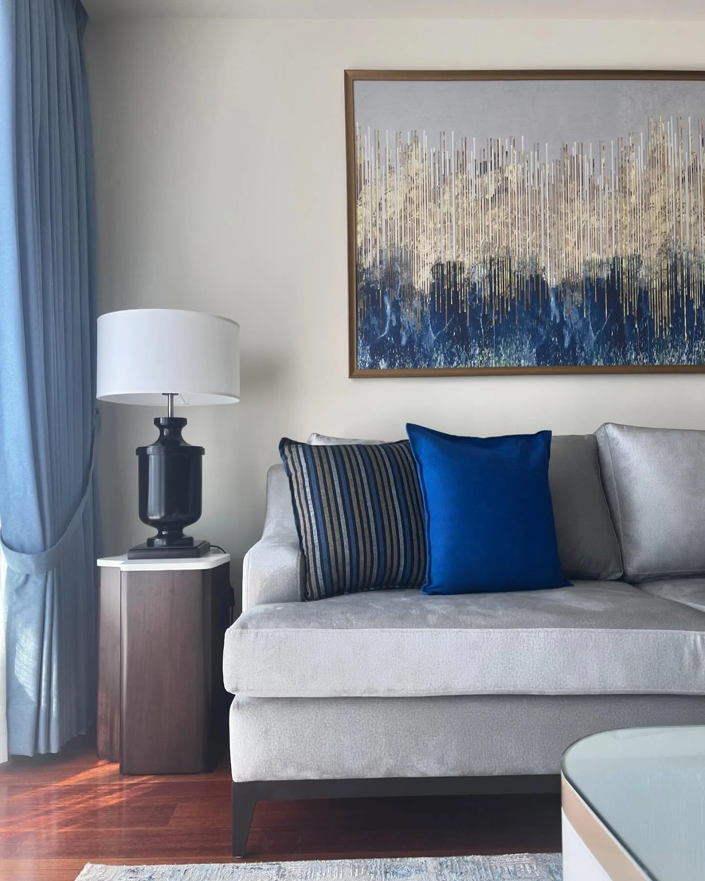 7. Polished Contrast with Bold Cobalt Accent (Blue and Grey Living Room Ideas)