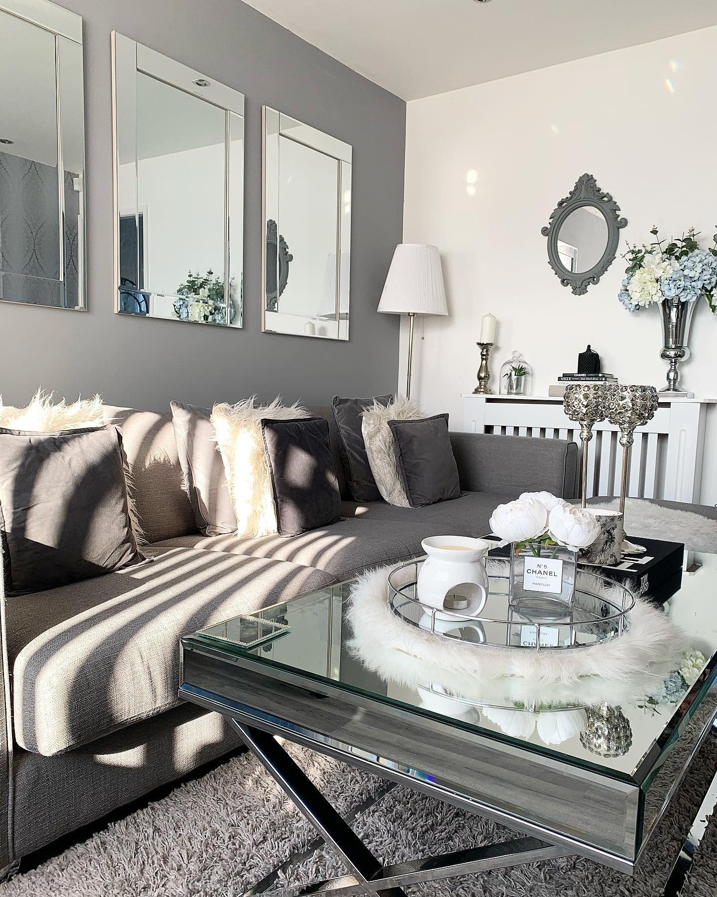 13. Refined Glam with Mirrored Accents (Gray Living Room Ideas)